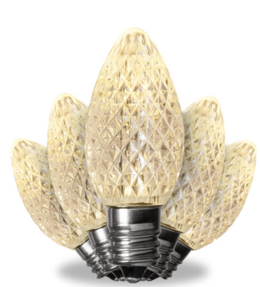 Close-up of a decorative LED light bulb designed to look like a blooming flower with beige petal-shaped shades.