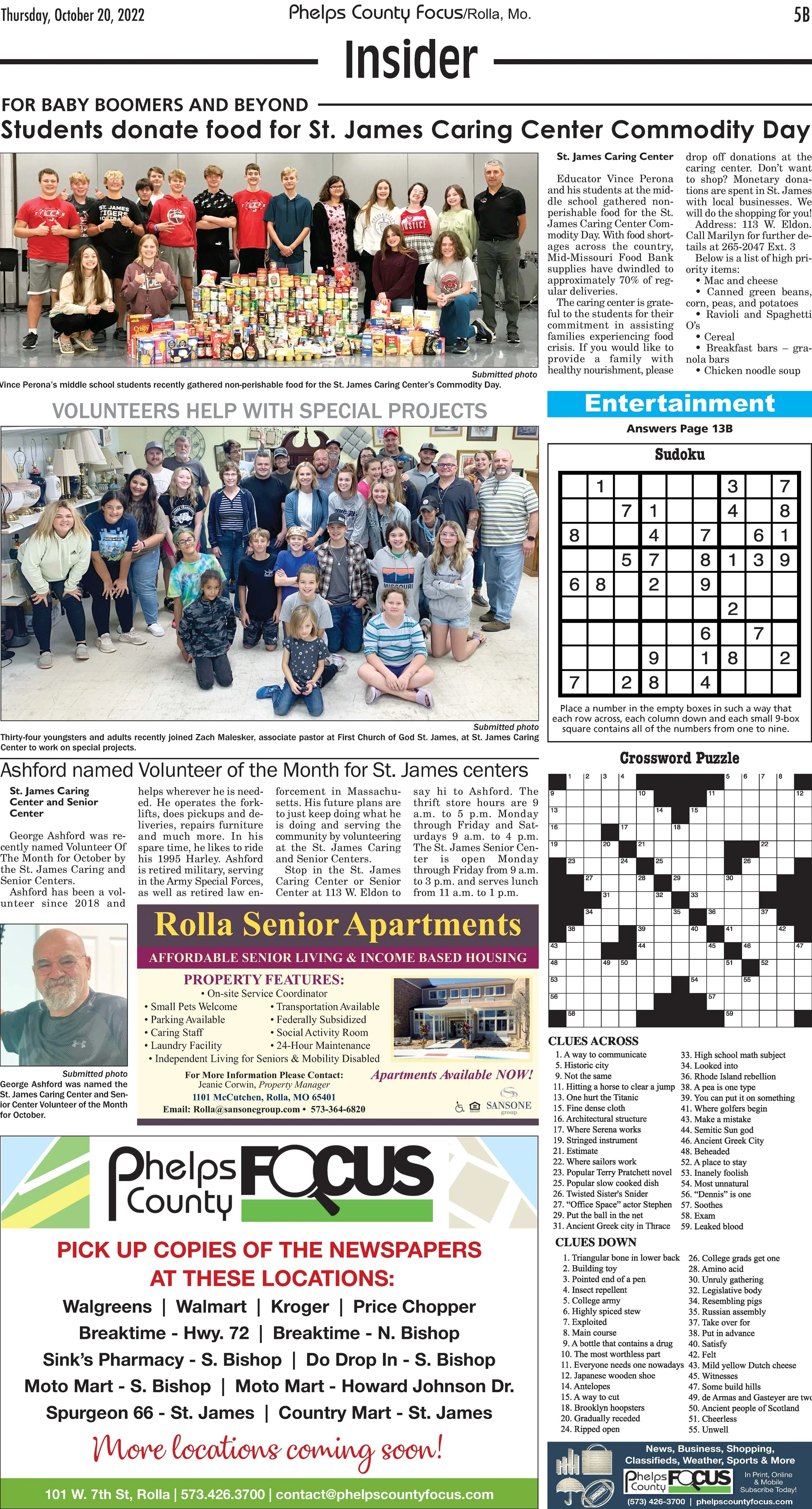 Front page of a local newspaper featuring two groups of people, students donating food and volunteers, along with crossword puzzles, Sudoku, and advertisements.