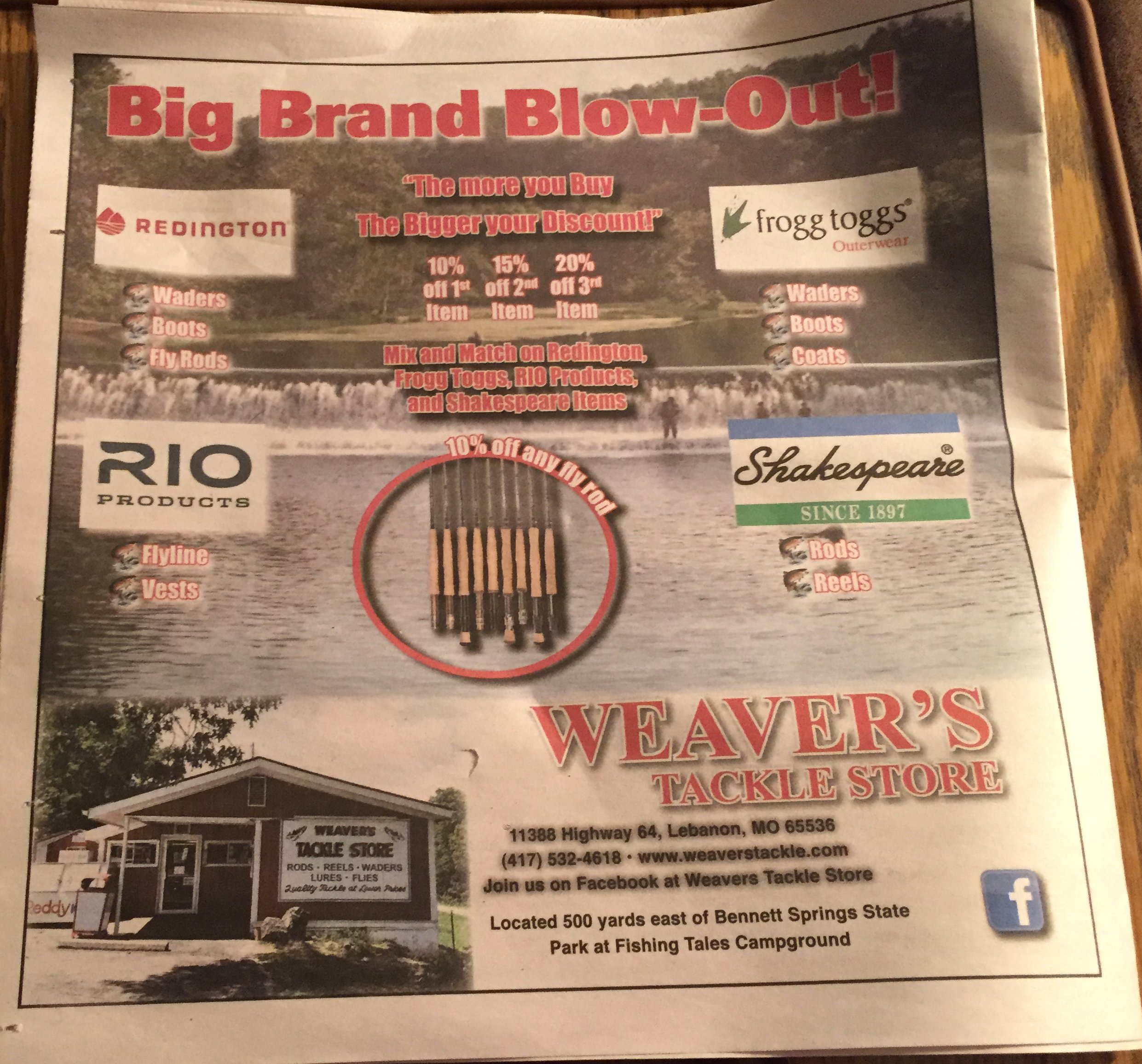 A newspaper advertisement for Weaver's Tackle Store, highlighting discounts on fishing gear such as waders, boots, fly rods, and flies. The store is located at 11388 Highway 64, Lebanon, Missouri, and is promoting its products with a tagline about bu