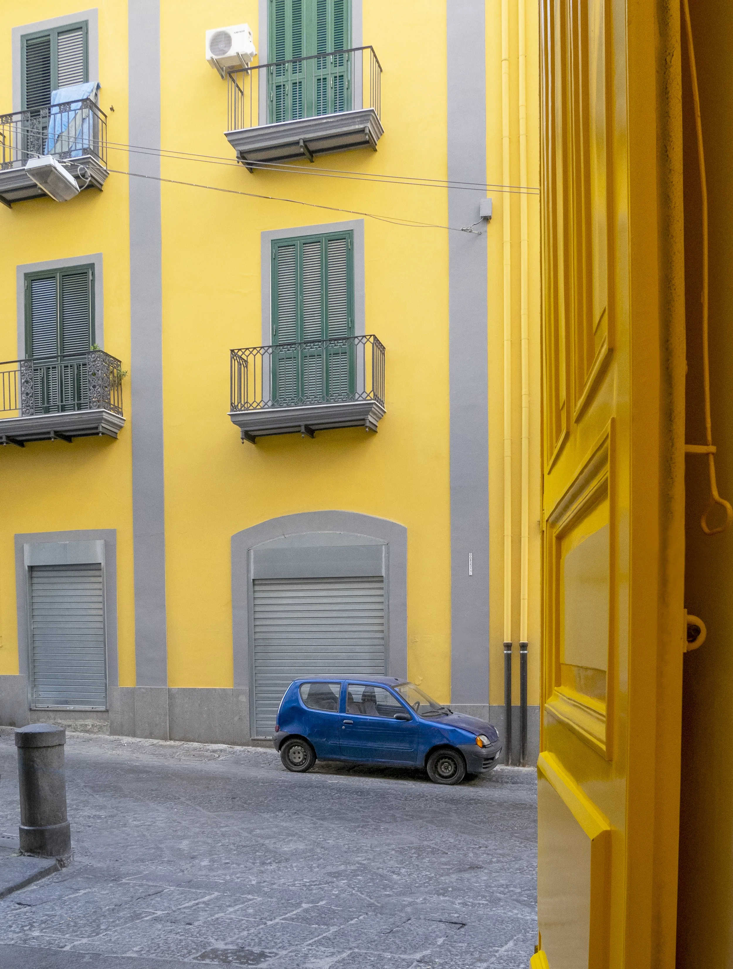 Yellow buildings, blue car, Napoli