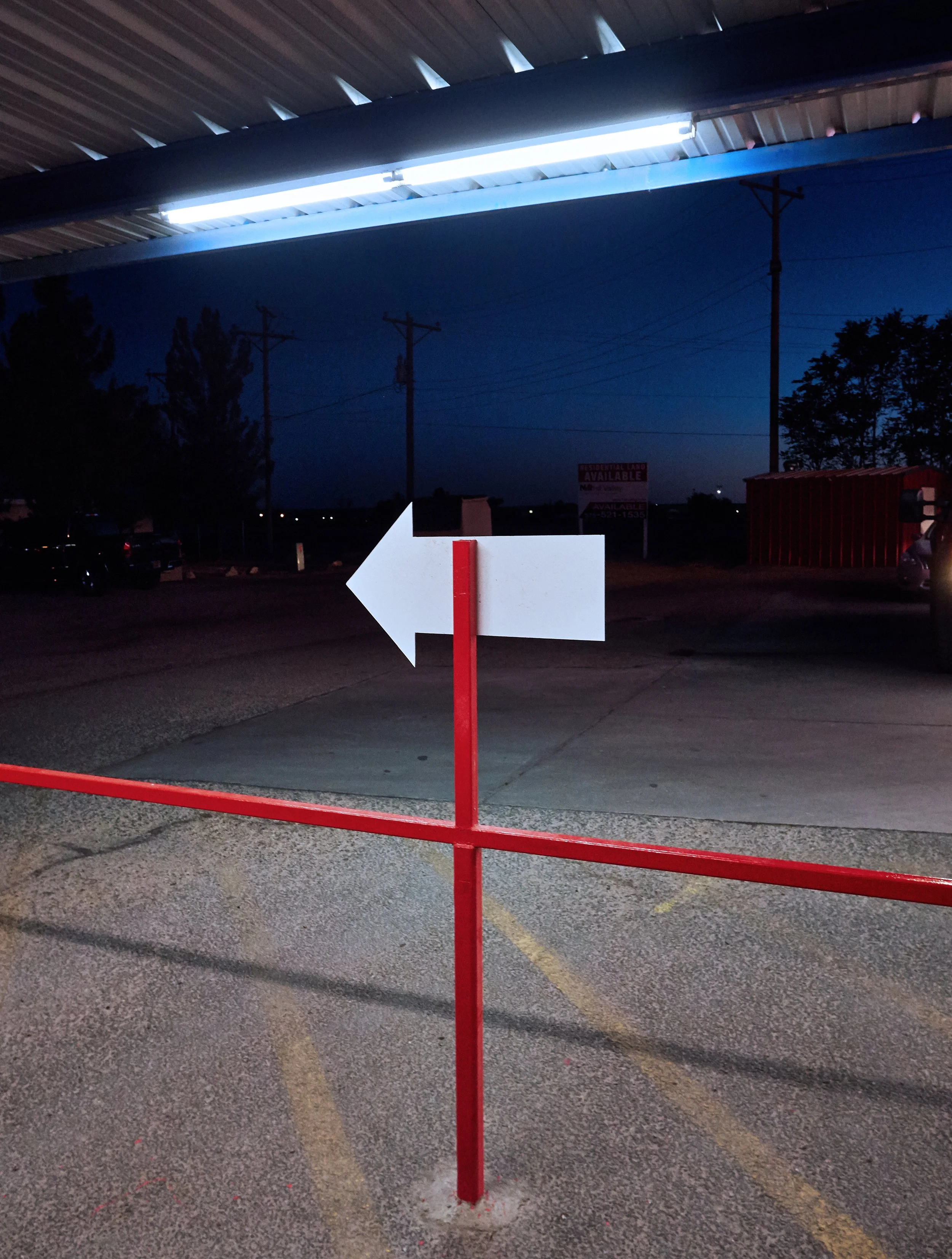 White arrow pointing left