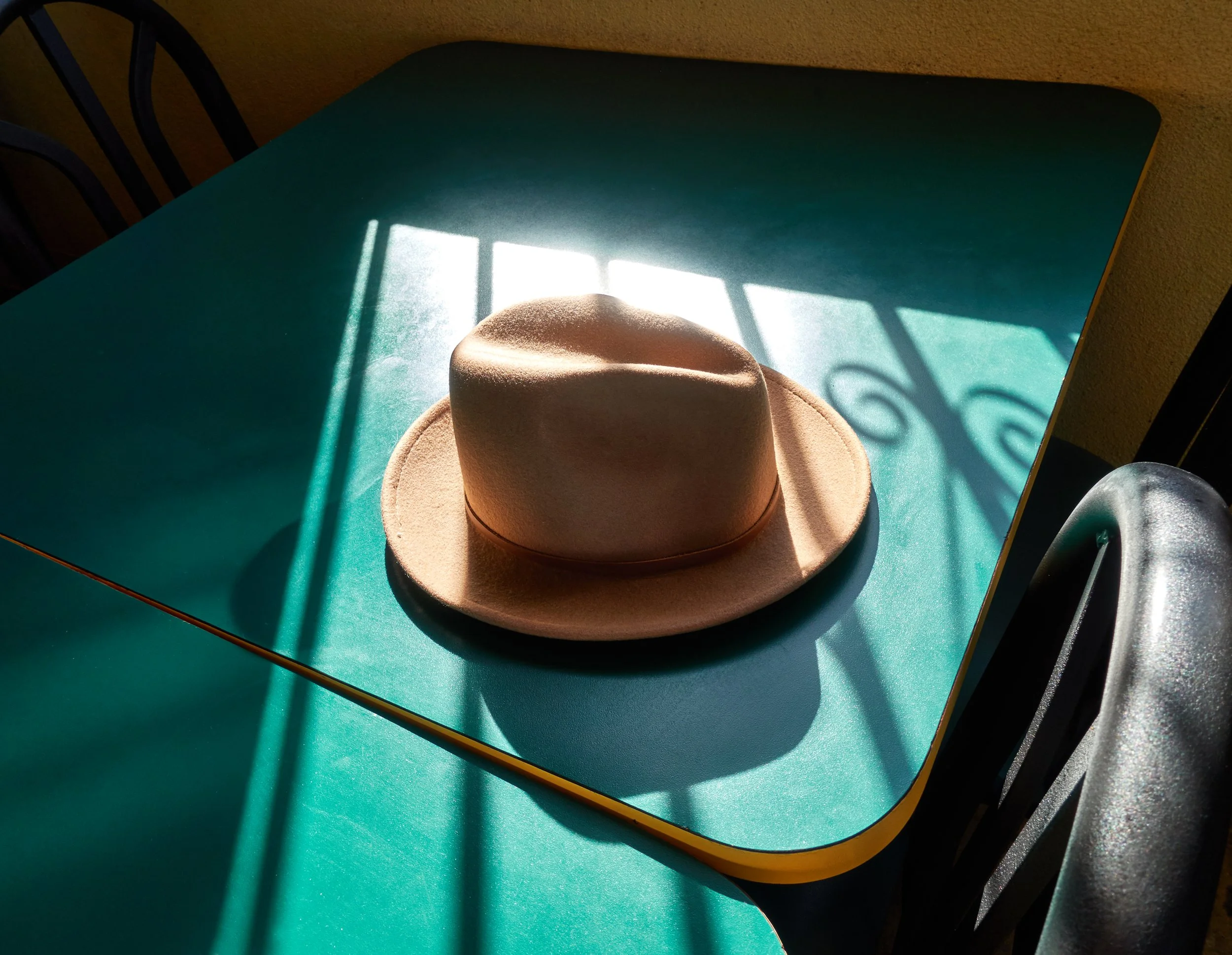 Alan's hat, green table