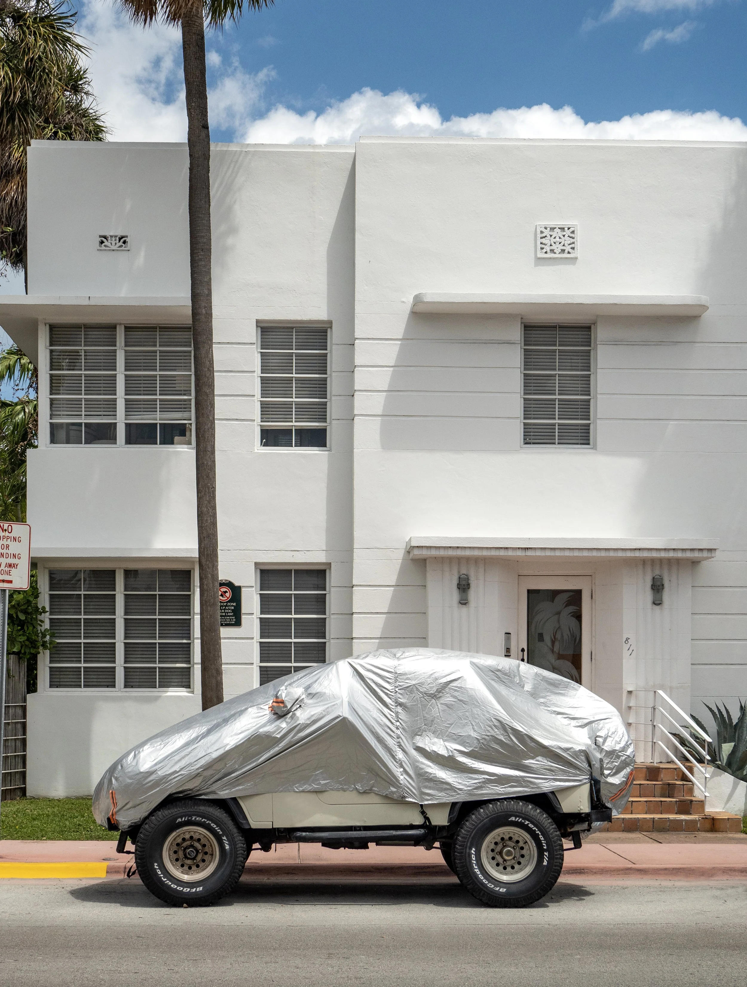Covered jeep and art deco hotel, Miami