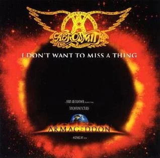 A promotional poster featuring the Aeromyth logo at the top, a fiery black hole in the center, and Earth at the bottom. The text reads: 'I don't want to miss a thing' and 'Armageddon.'