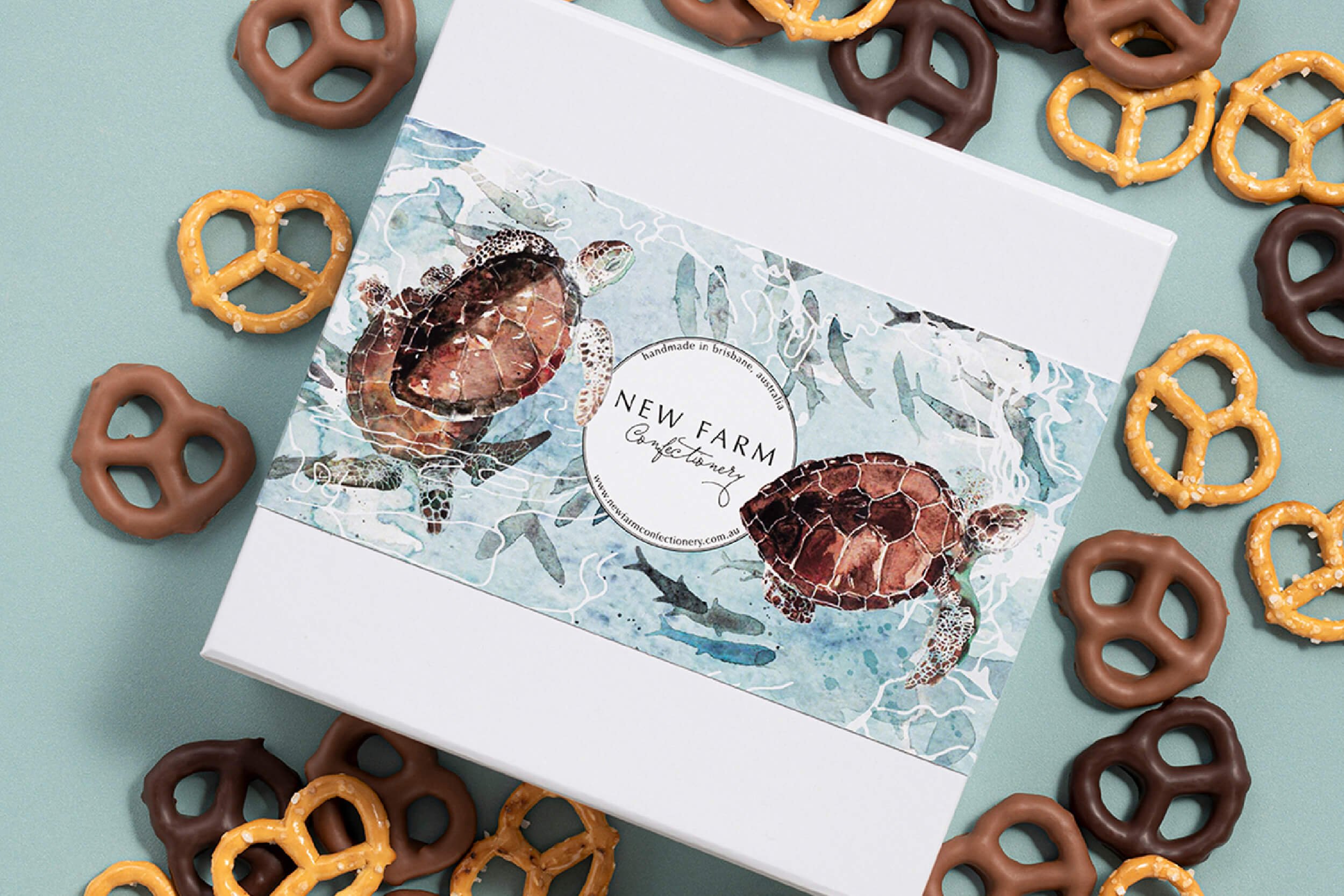 Hand-painted watercolour sea turtle packaging illustration created for New Farm Confectionery Father’s Day seasonal gift box campaign.