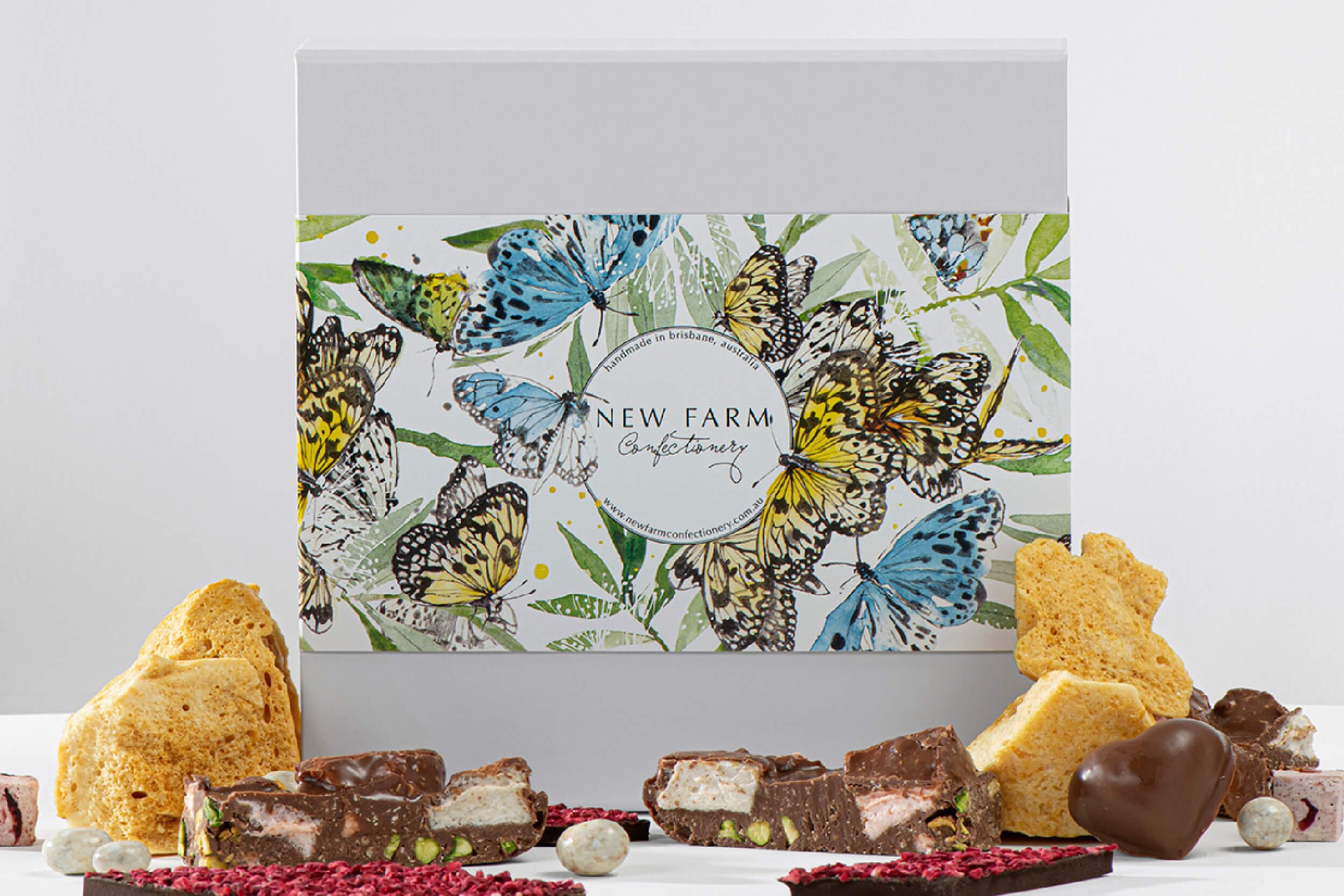 Hand-painted watercolour butterfly packaging illustration created for New Farm Confectionery Mother’s Day seasonal gift box campaign.