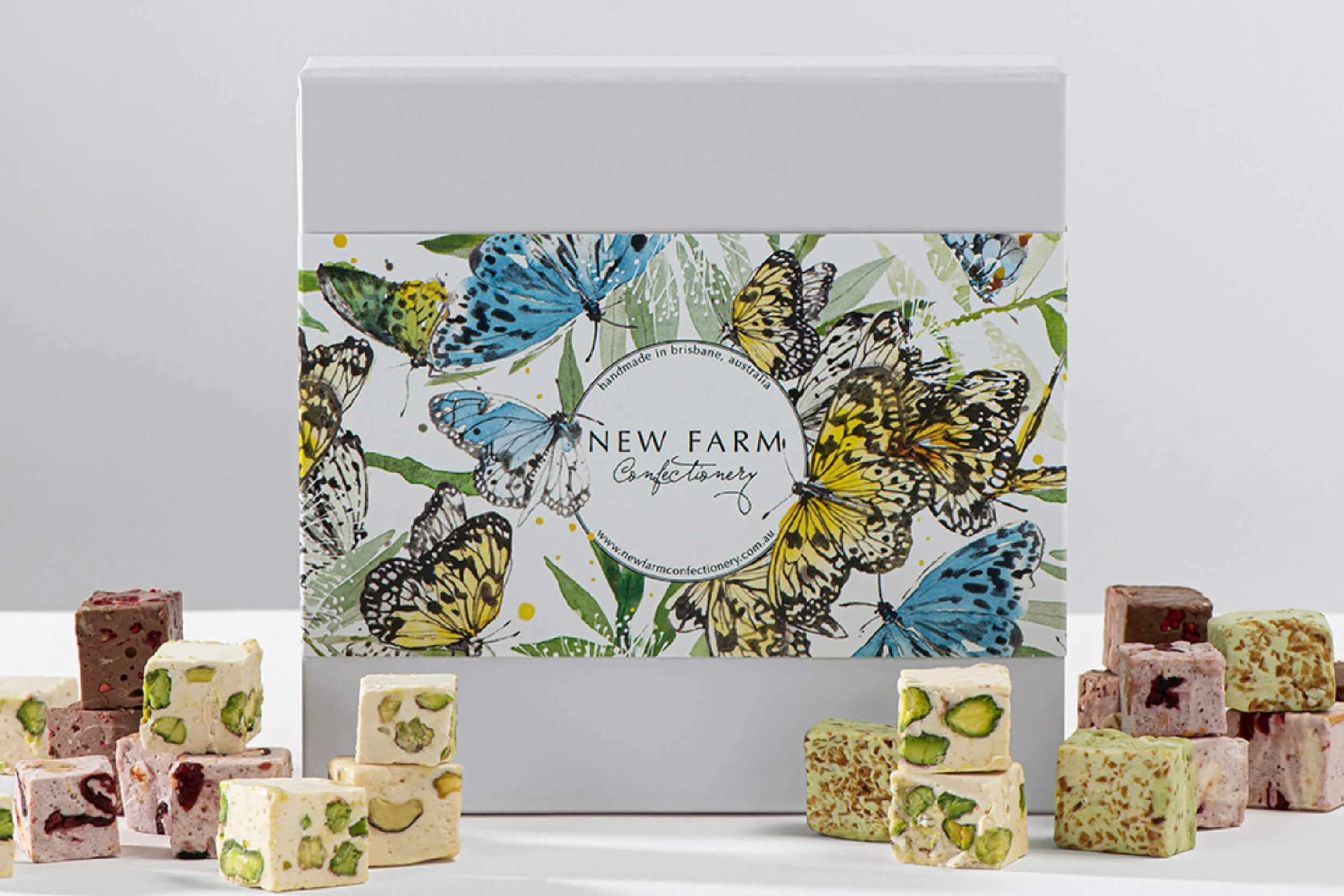 Hand-painted watercolour butterfly packaging illustration created for New Farm Confectionery Mother’s Day seasonal gift box campaign.
