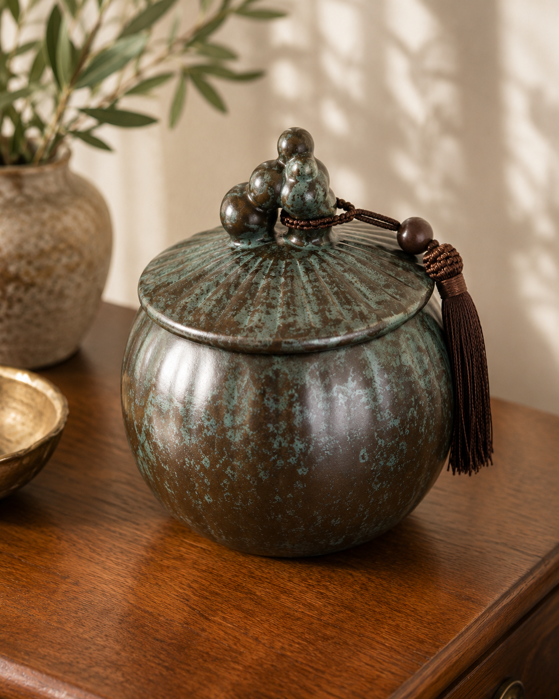brass and green ceramic jar.PNG