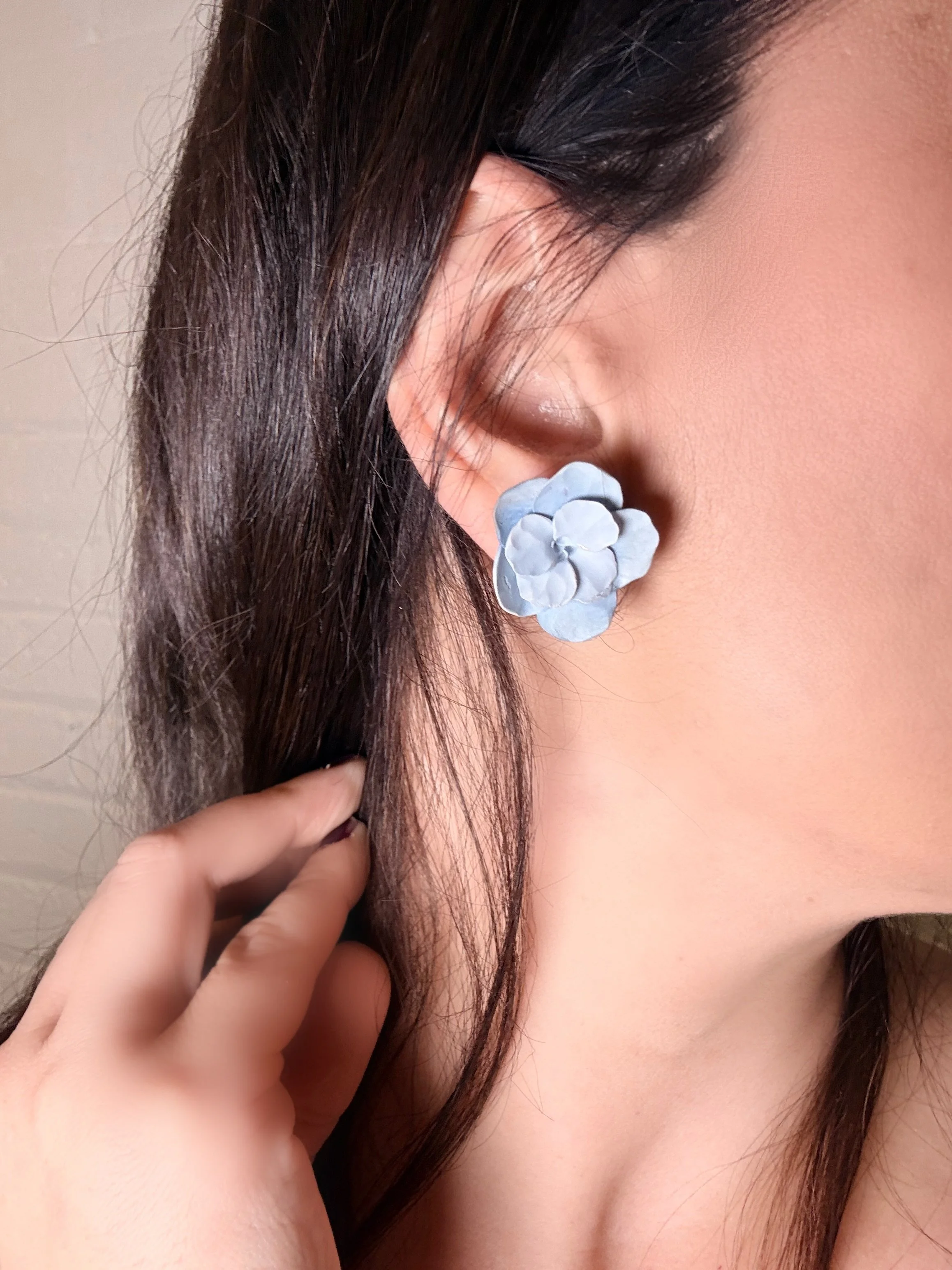 paloma-clay-model-wearing-light-blue-flower-stud-earring.jpeg