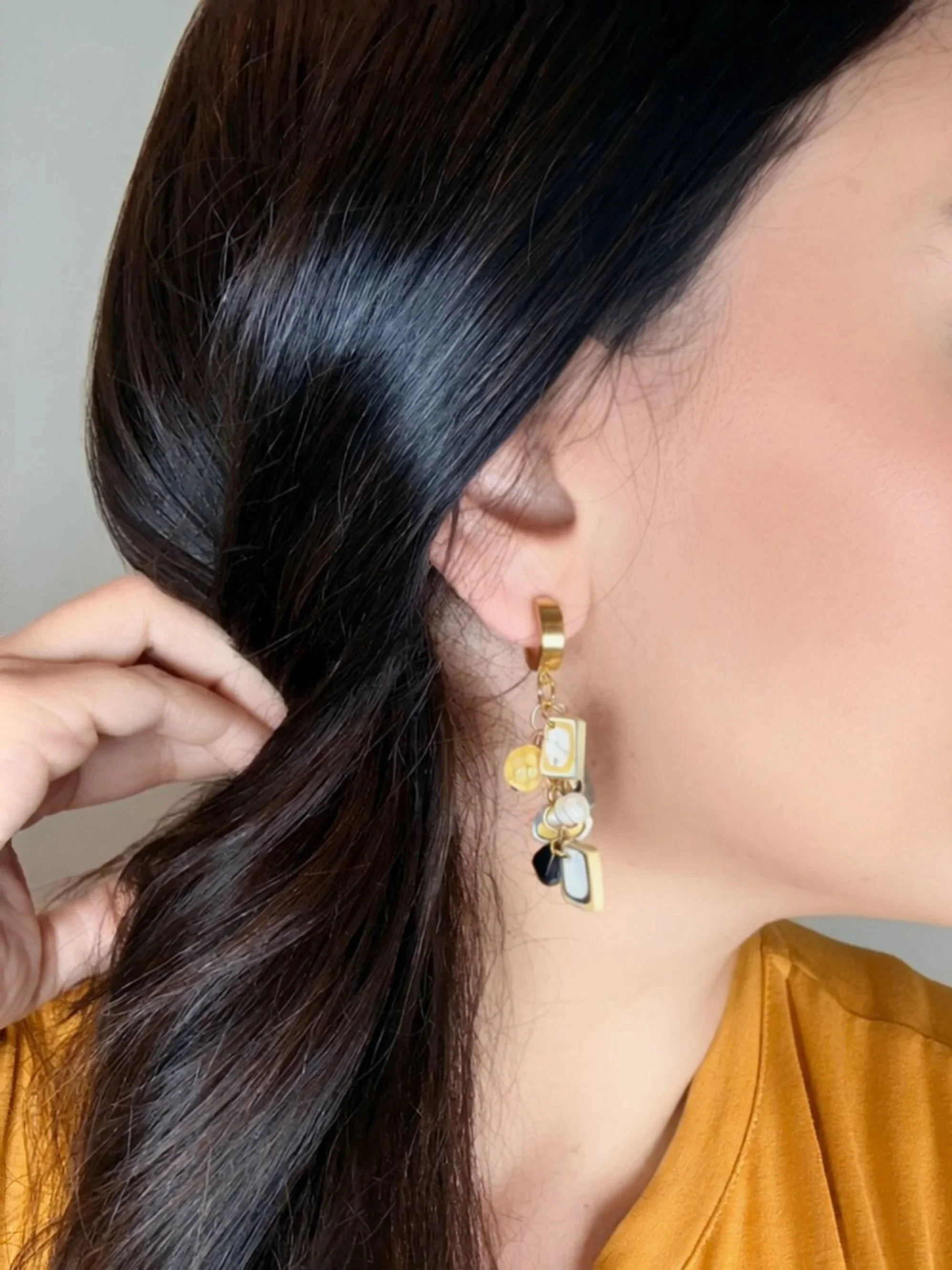 paloma-clay-model-wearing-gold-beaded-dangle-earrings.jpg