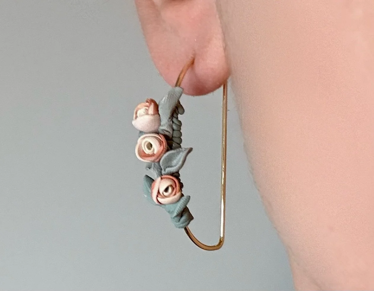 paloma-clay-model-wearing-floral-charm-bracelet.jpeg