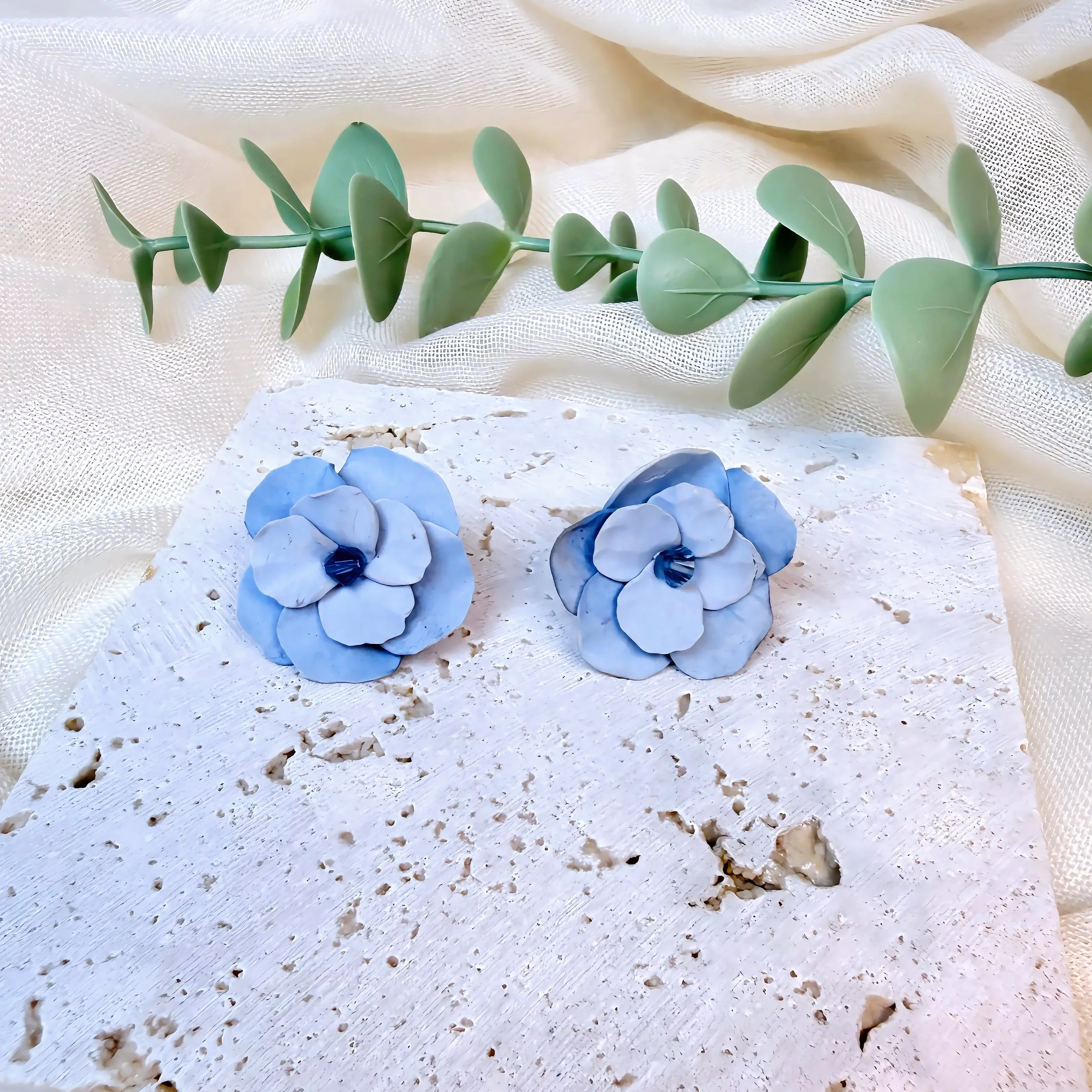 paloma-clay-light-blue-flower-stud-earrings.jpeg