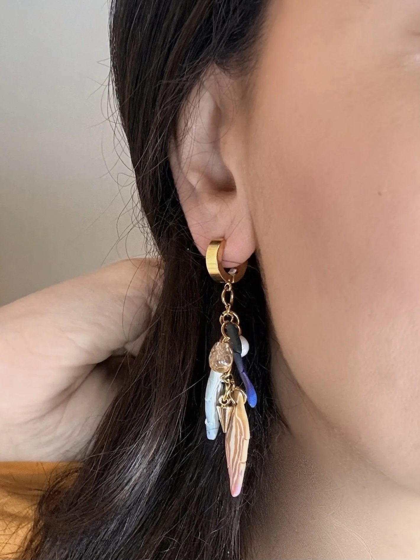 paloma-clay-model-wearing-navy-feather-dangle-earrings.jpg
