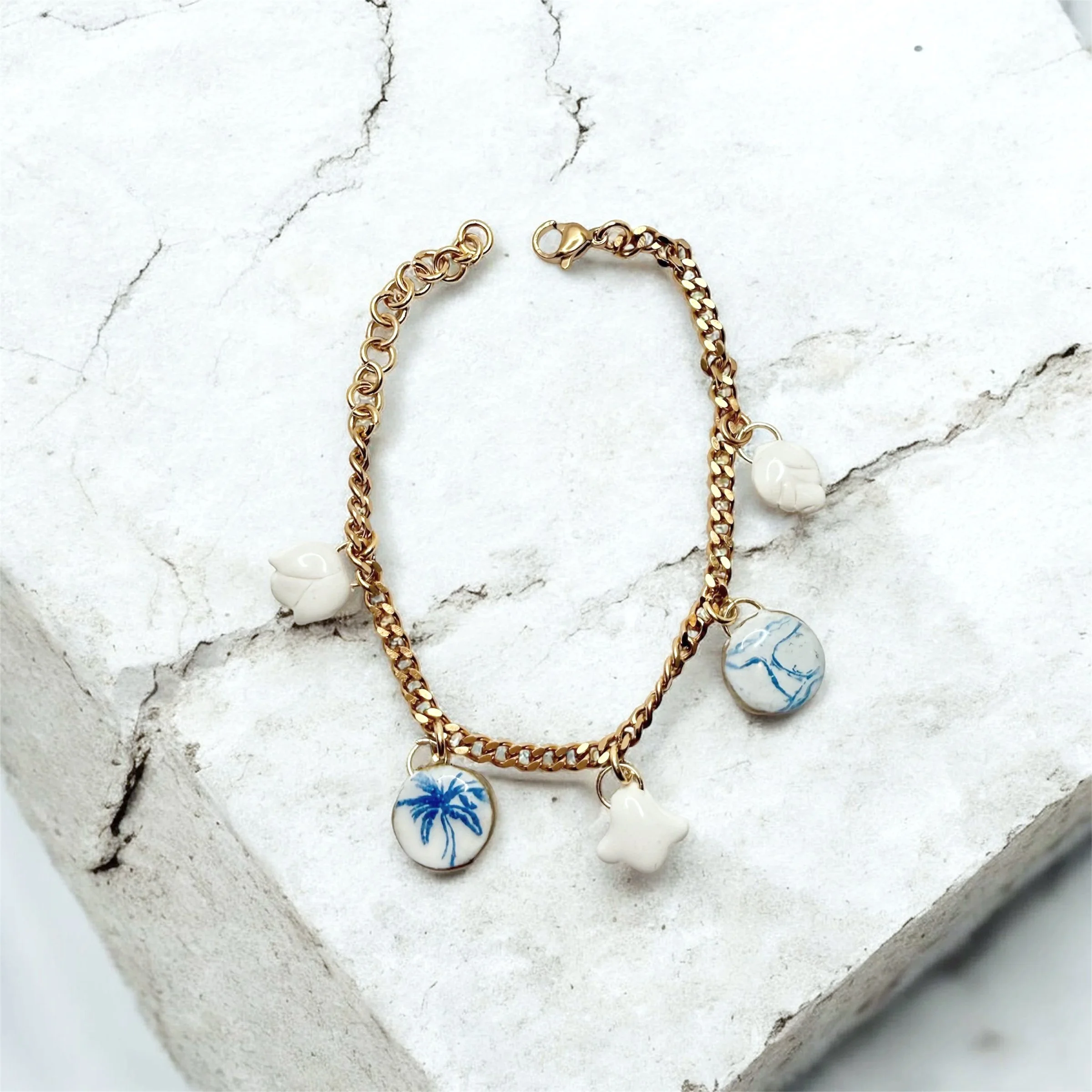 paloma-clay-gold-chain-charm-bracelet.jpg
