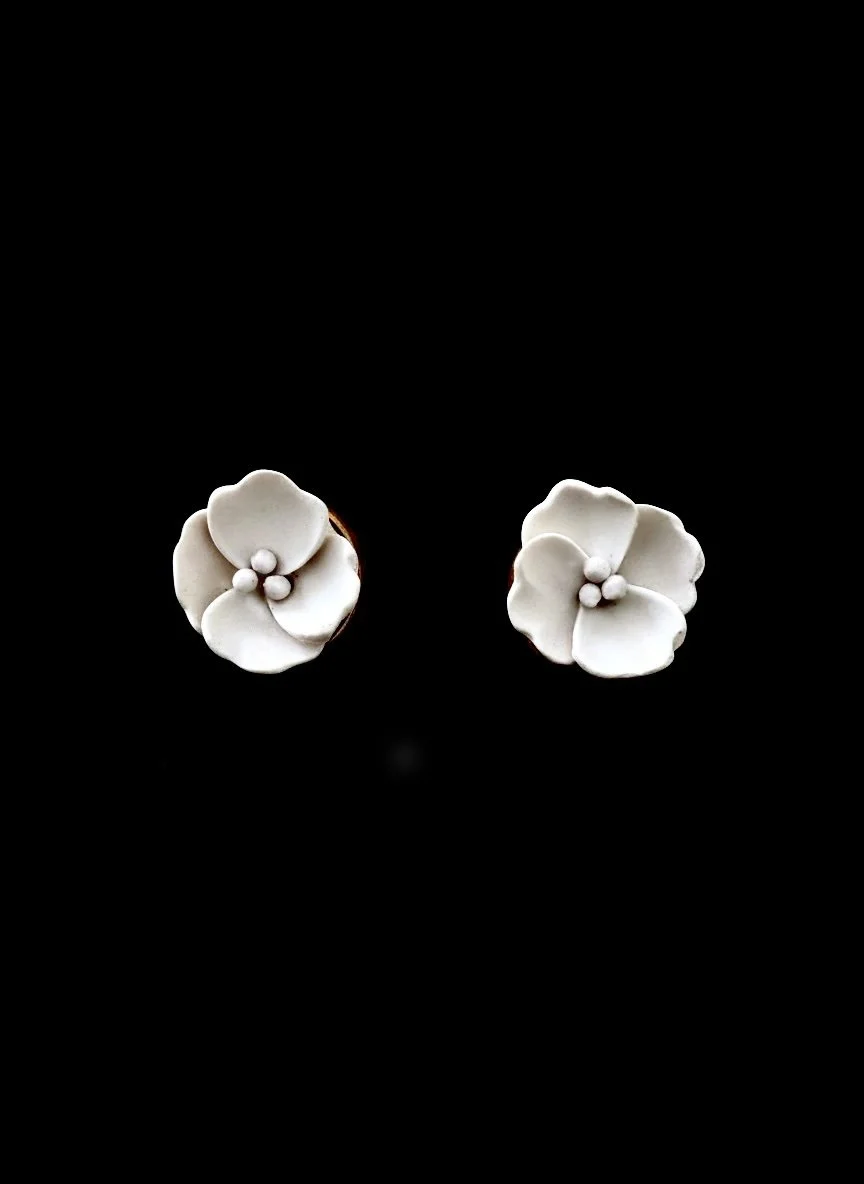 paloma-clay-white-flower-stud-earrings-black-bg.jpg