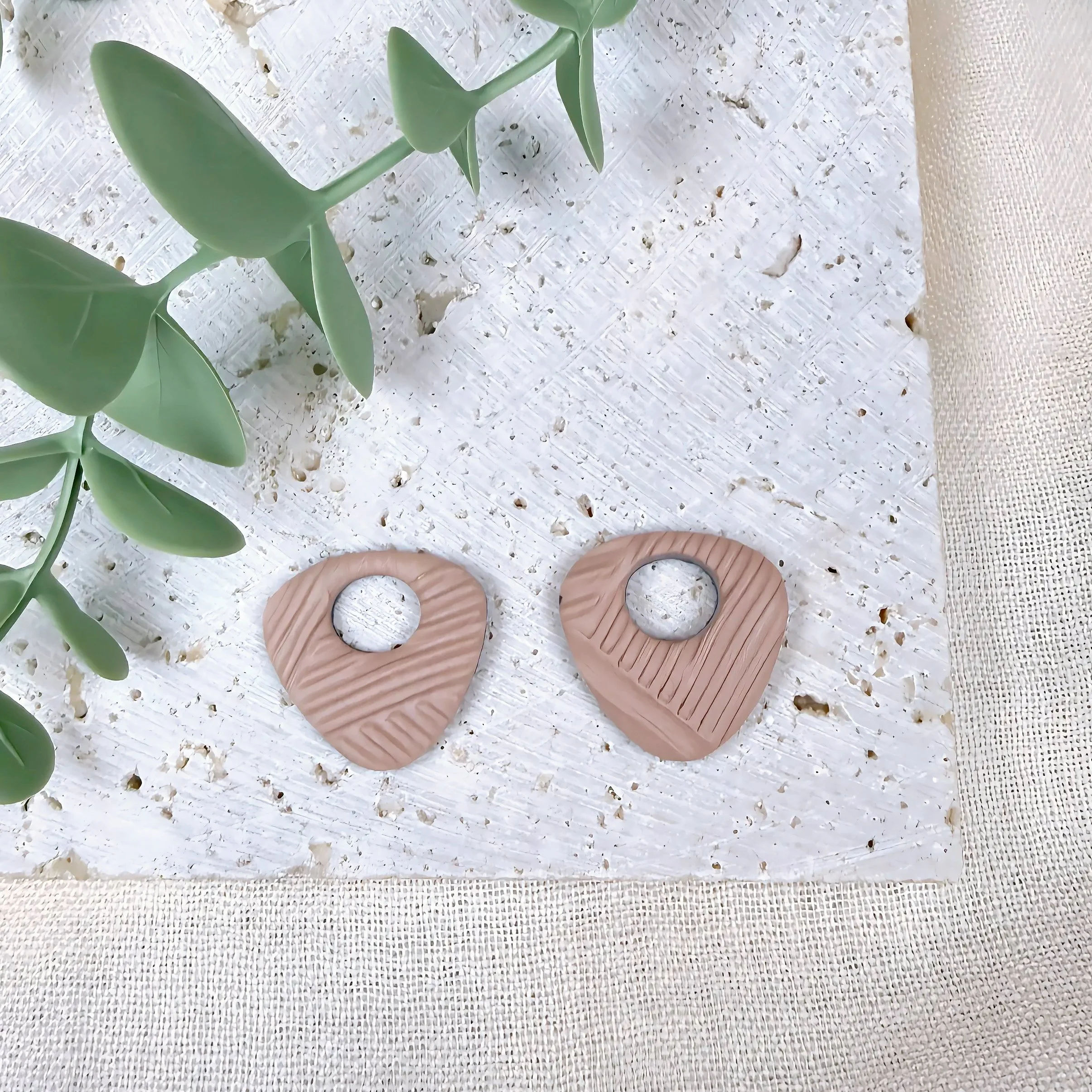 paloma-clay-pink-textured-teardrop-stud-earrings.jpeg