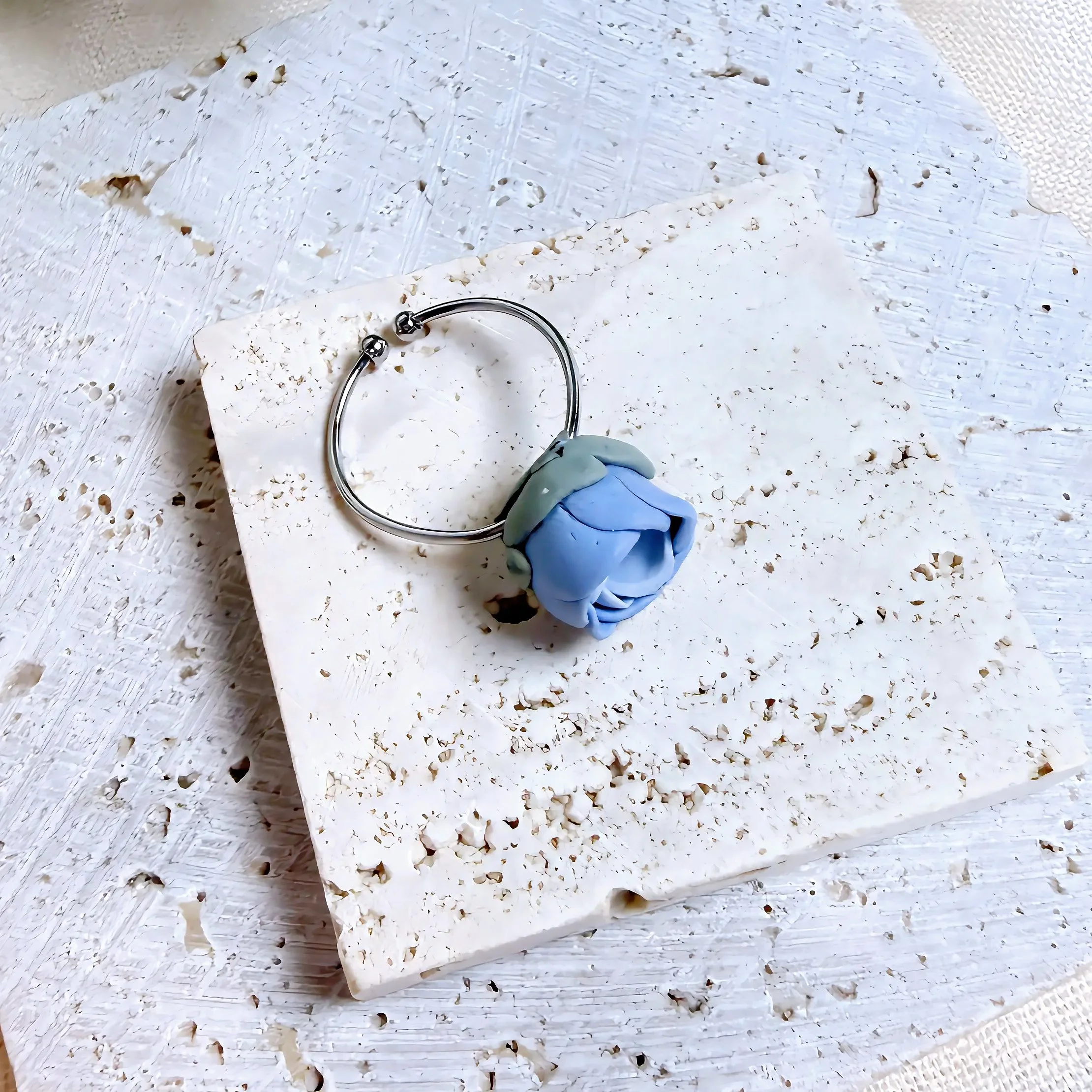 paloma-clay-model-wearing-blue-marble-ring.jpeg