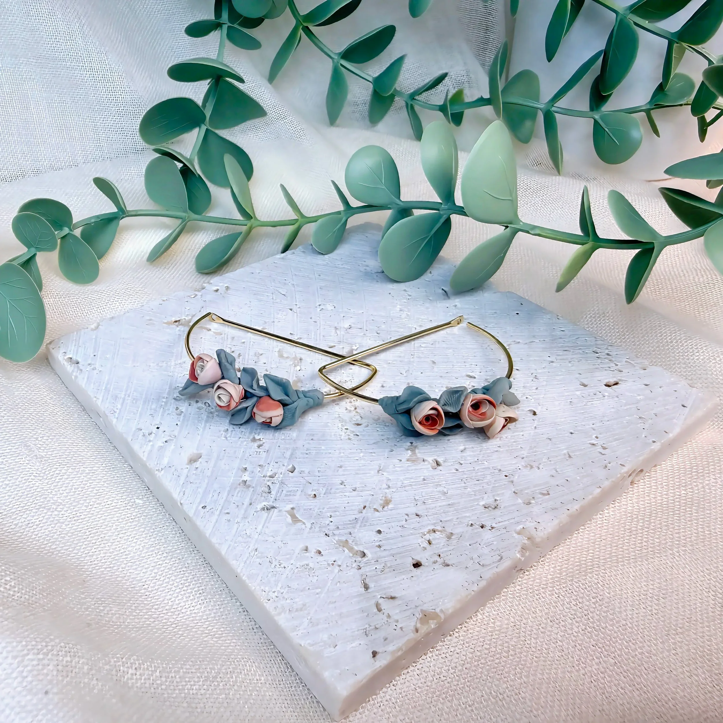 paloma-clay-floral-charm-infinity-bracelet.jpeg