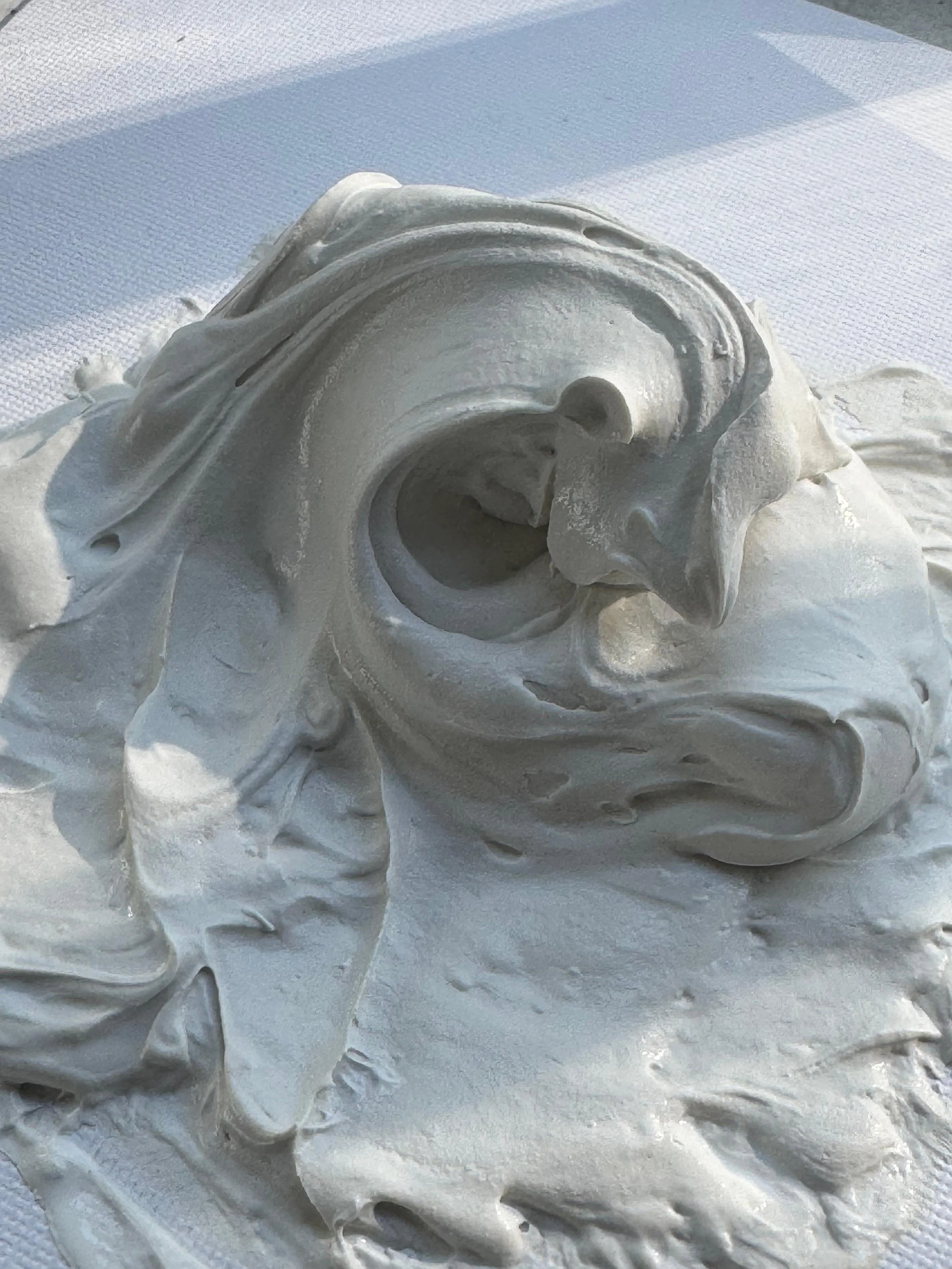 Close-up of white acrylic paint.
