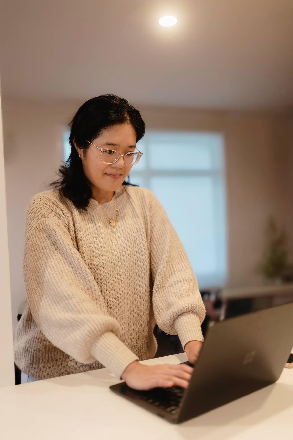 An Occupational Therapist working on their laptop