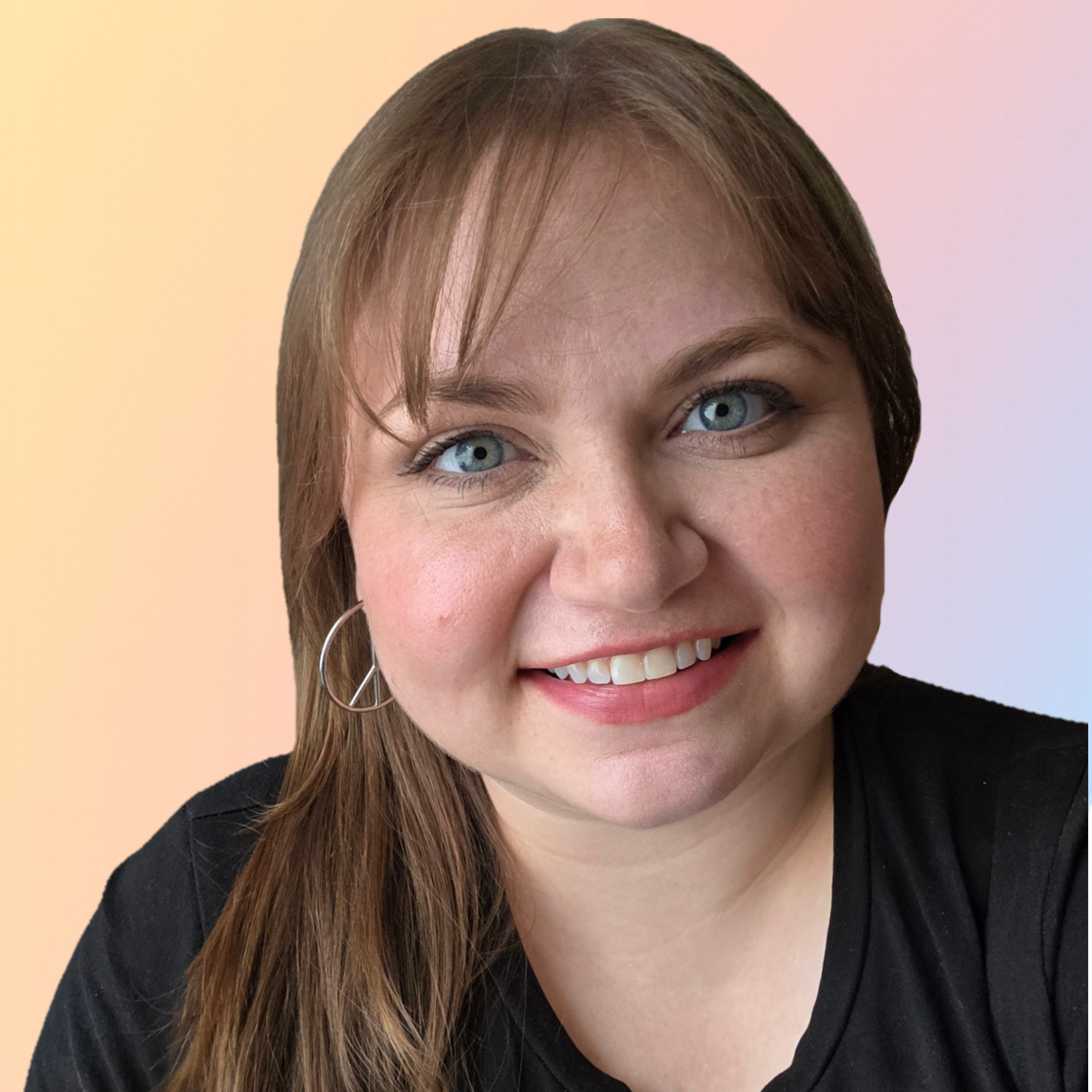 Close-up of a woman with blue eyes, brown hair, earrings, smiling, wearing a black top, with a soft pastel-colored background.