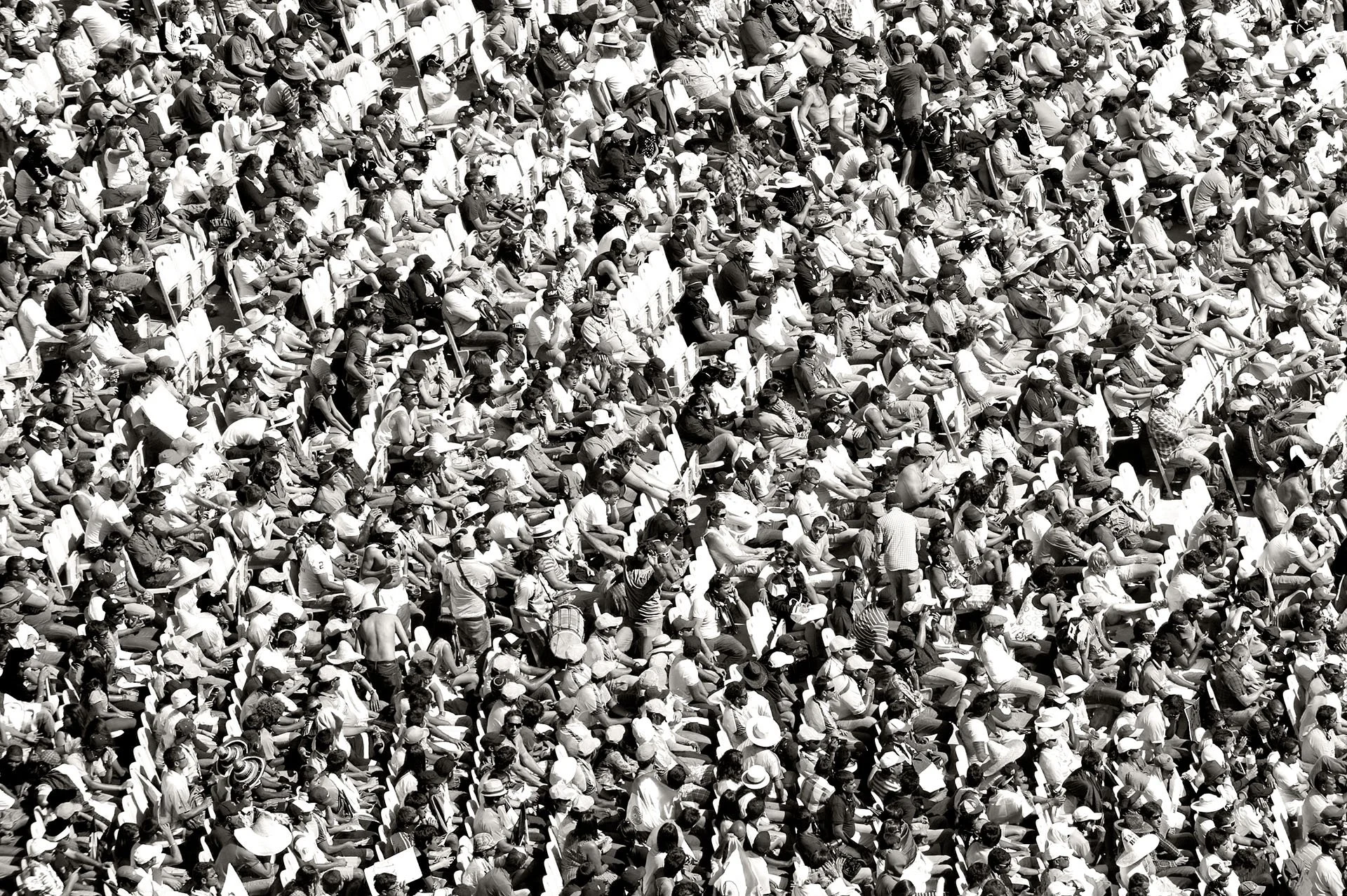 Black and white photo of a packed crowd at the Melbourne Cricket Ground on day two of the Australia v India Boxing Day Test, 27 December 2011.