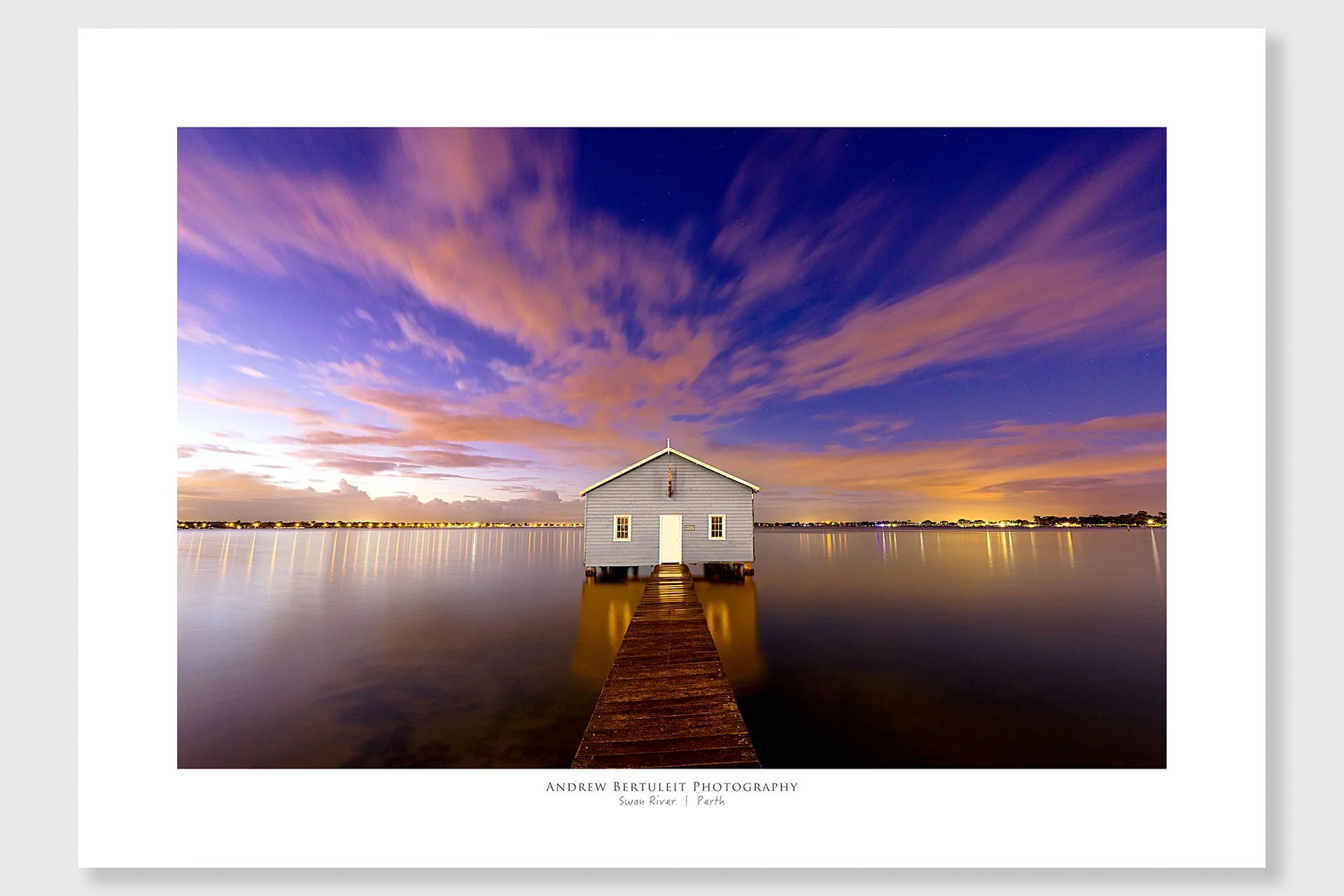 Blue Boathouse print with white border, ready for a standard frame