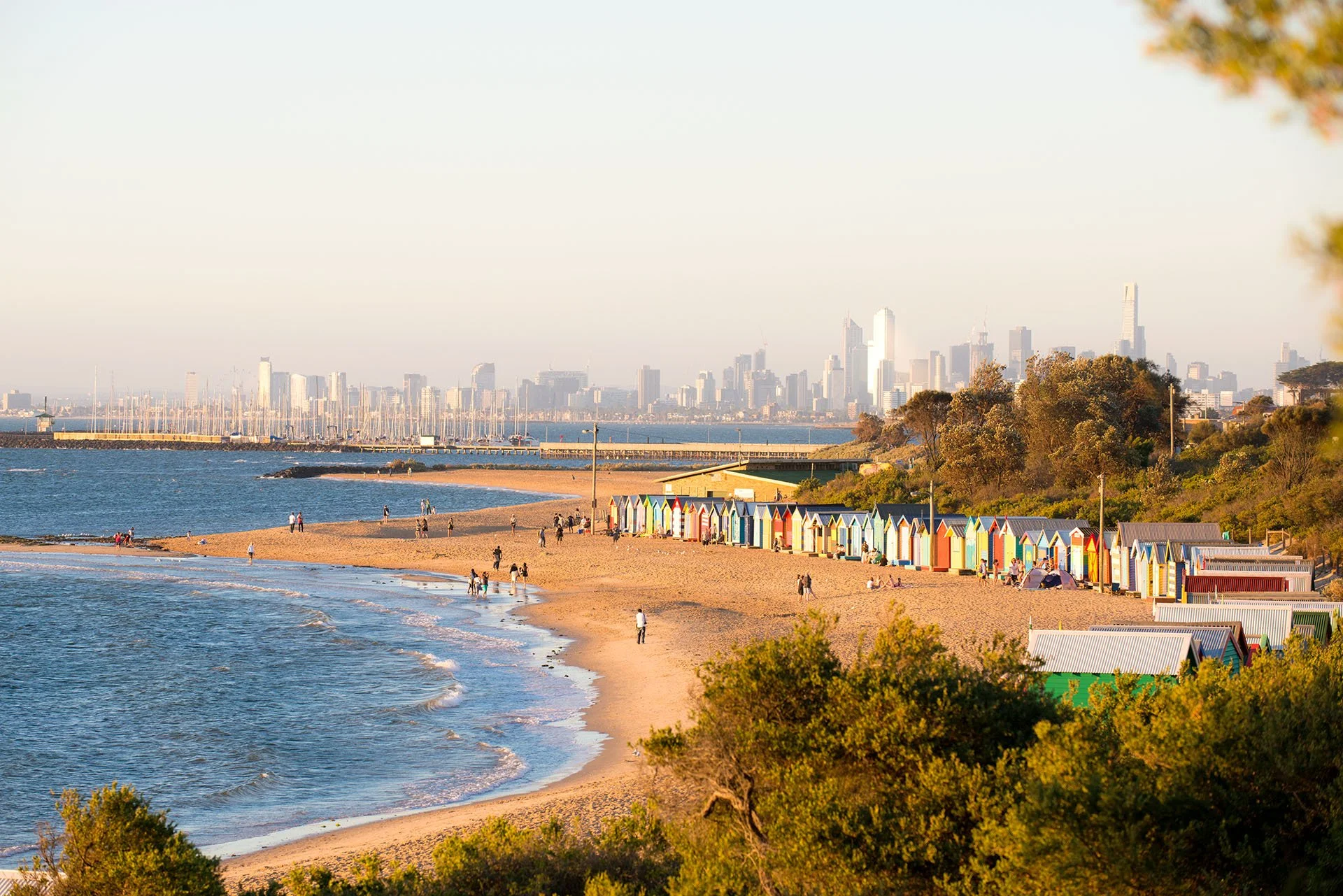 Colourful row of beach huts close to the water