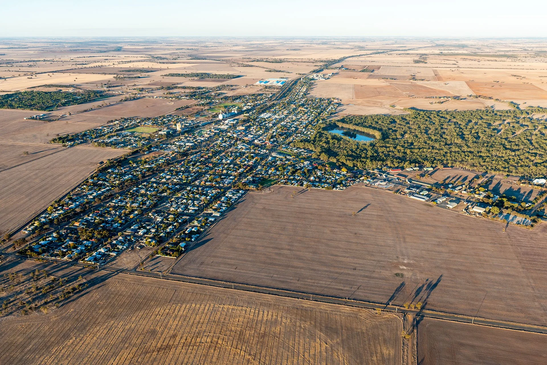 Aerial image of the Victorian town of Nhill surrounded by brown fields.