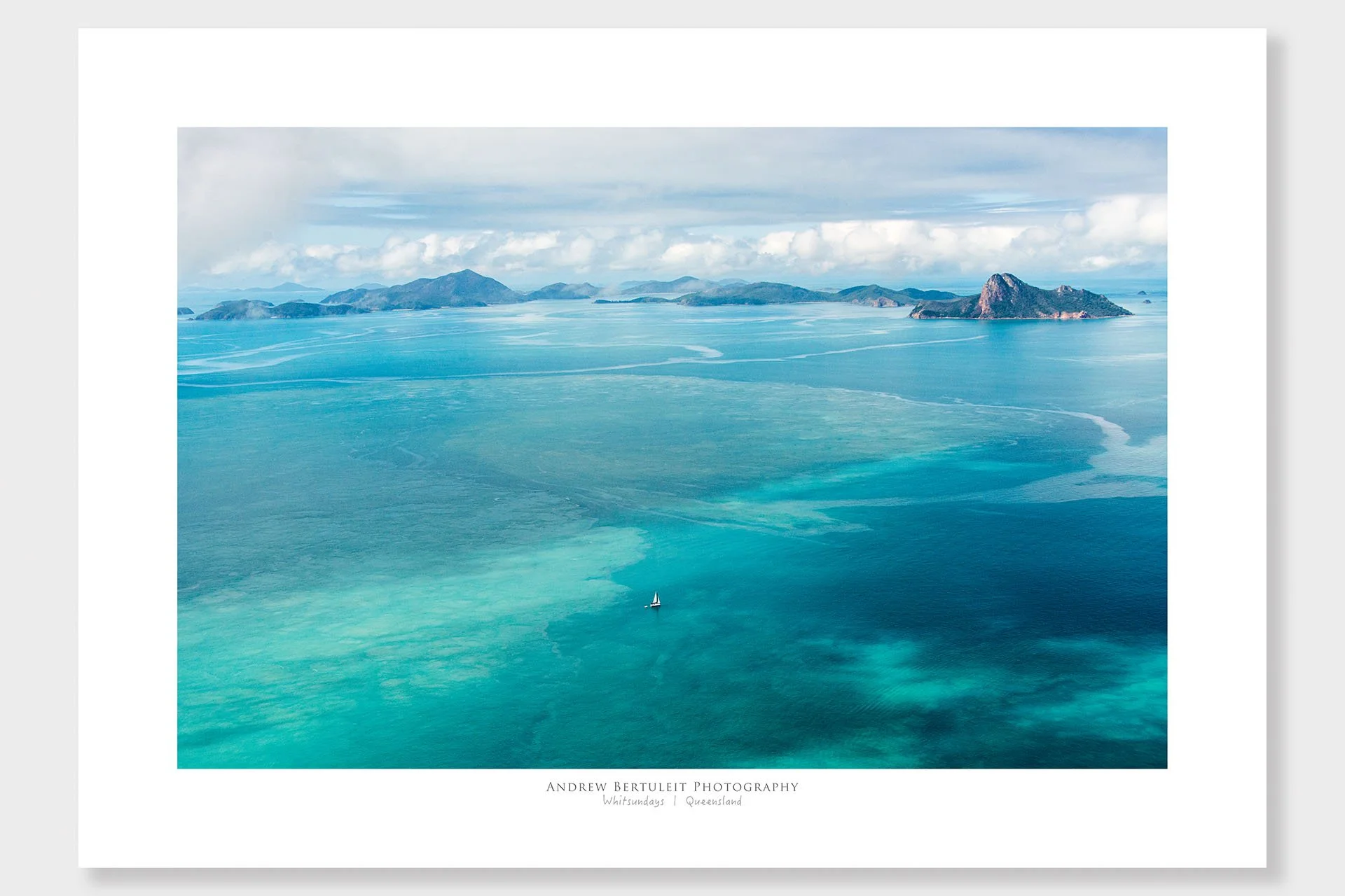 Whitsundays sailing boat print with white border, ready for a standard frame.