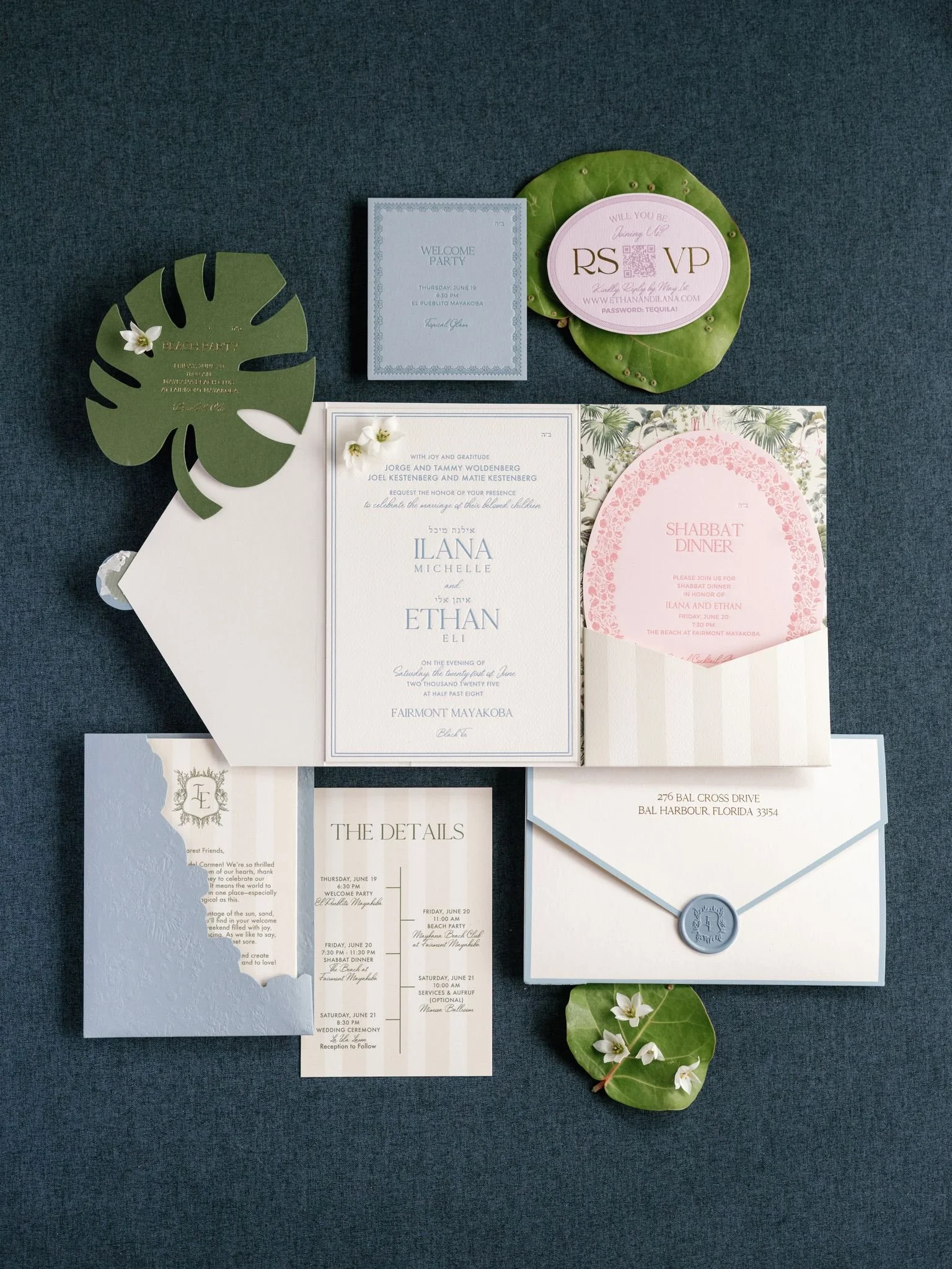 Collection of wedding and event invitations and cards, including a white book-like card with embossed details, a pink and white circular card with a floral pattern, a green leaf-shaped card with gold lettering, and a blue-gray invitation with a monog