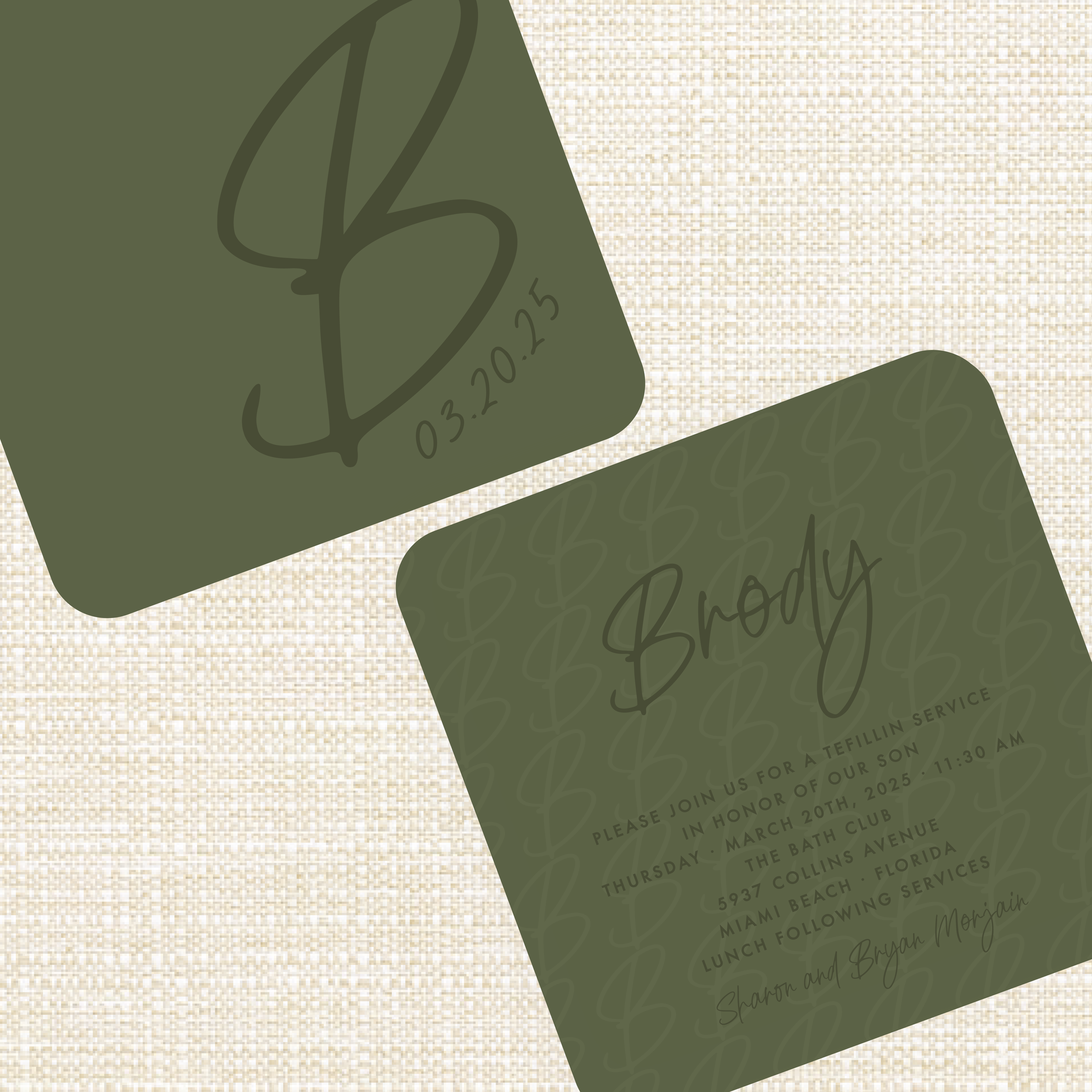 Close-up of a dark green invitation card with cursive text and a section of a beige textured background.