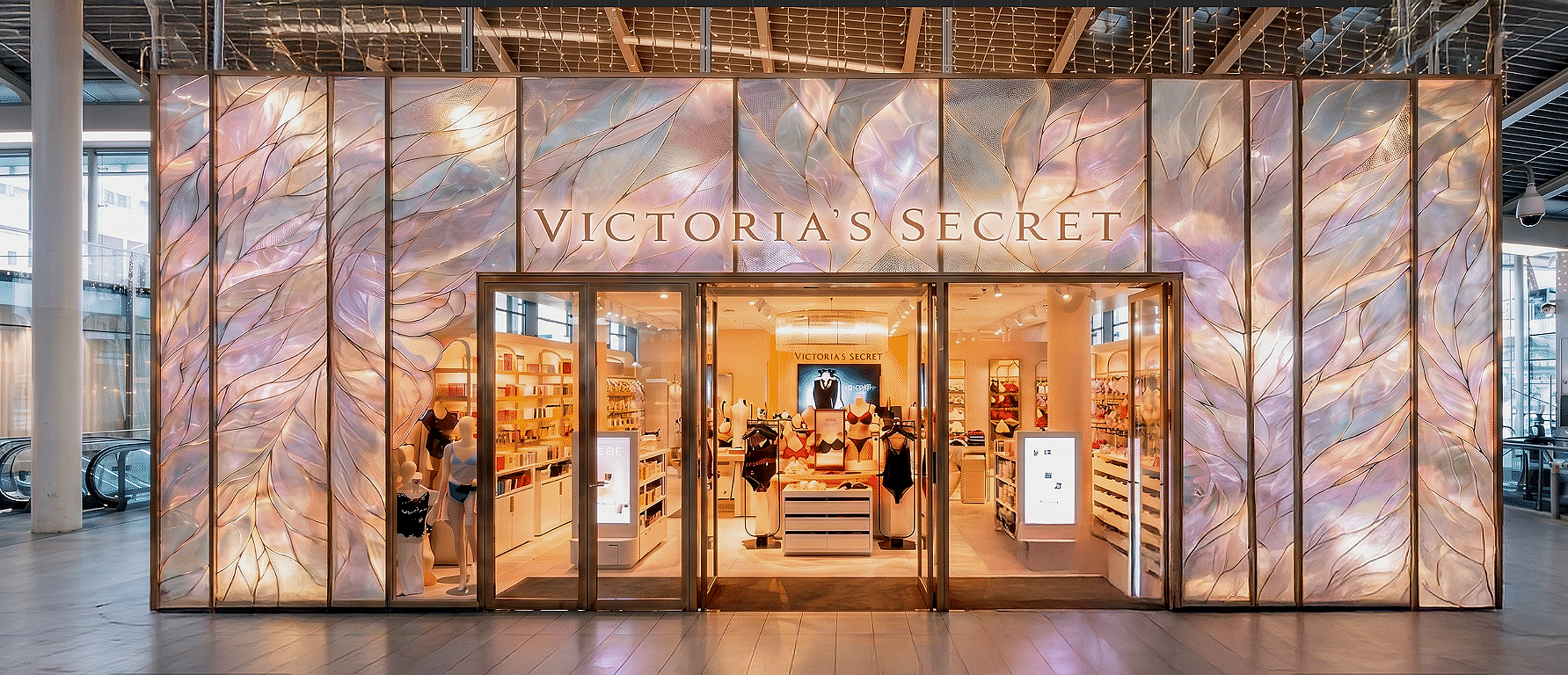 Victoria's Secret feather facade concept, turning from a retail unit into a train station landmark