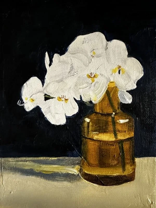 Janet Morris painting of white flowers in a brown glass vase on a table, dark background.