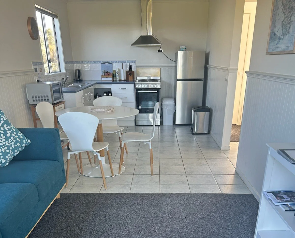 Cabin kitchen and dining area at Prom Gate Getaway near Wilsons Prom