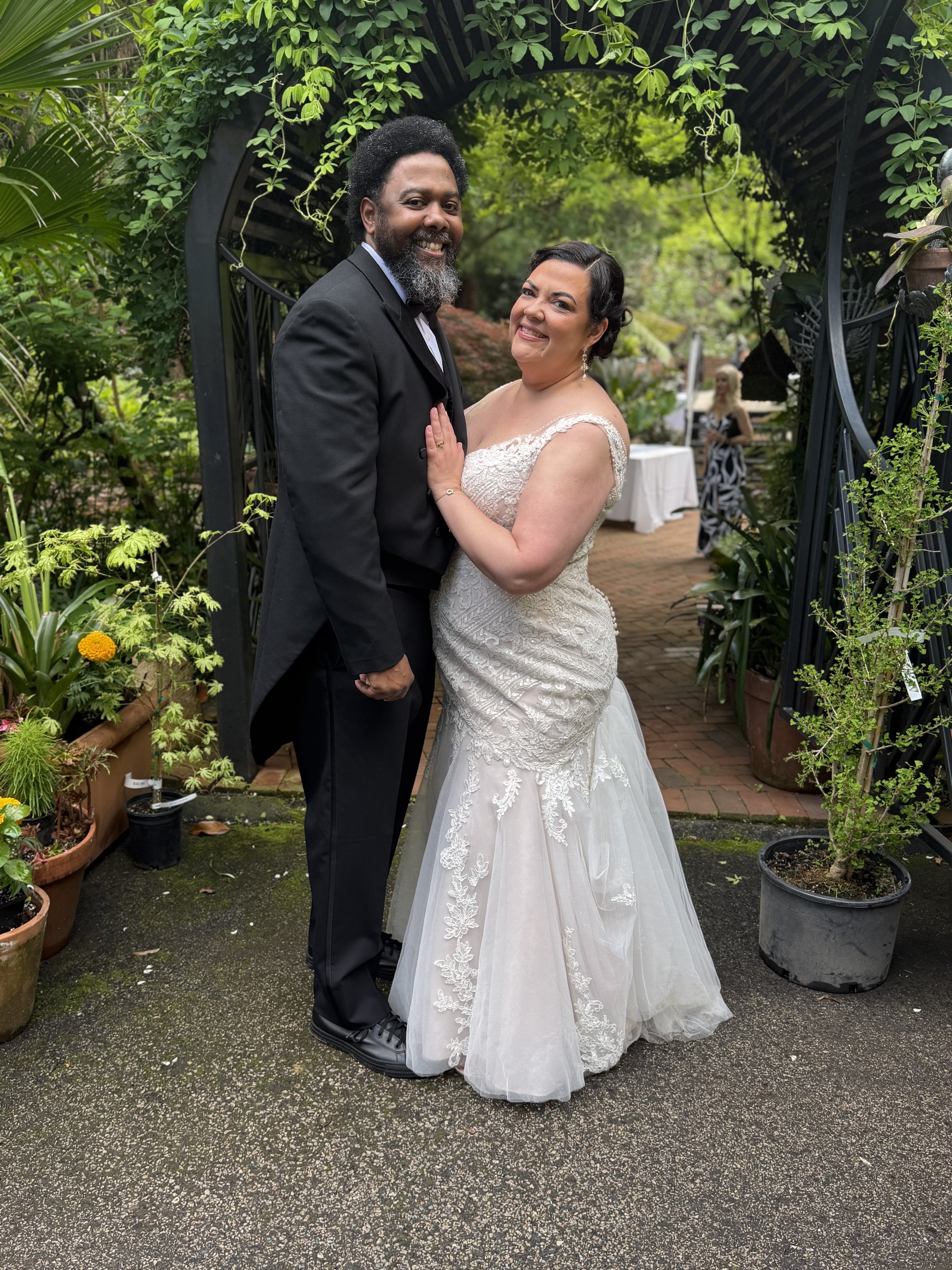 Laurie’s customers, Fernando and Kate embracing by the lake on their wedding day.