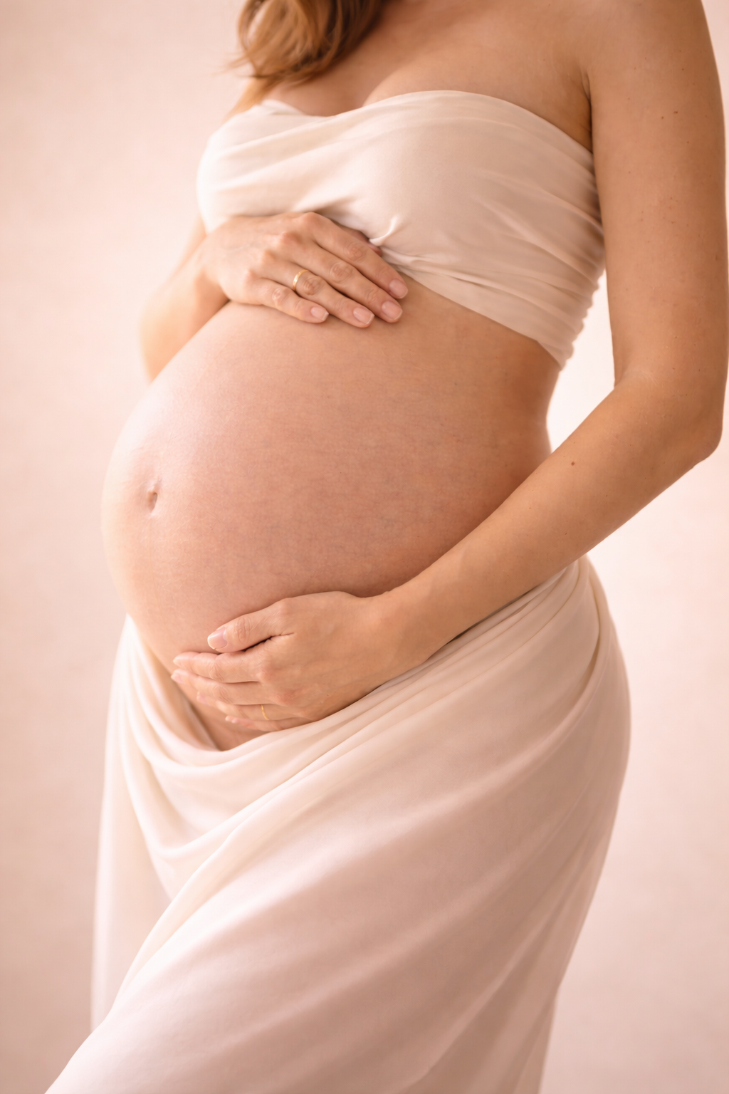 A pregnant woman caressing her belly