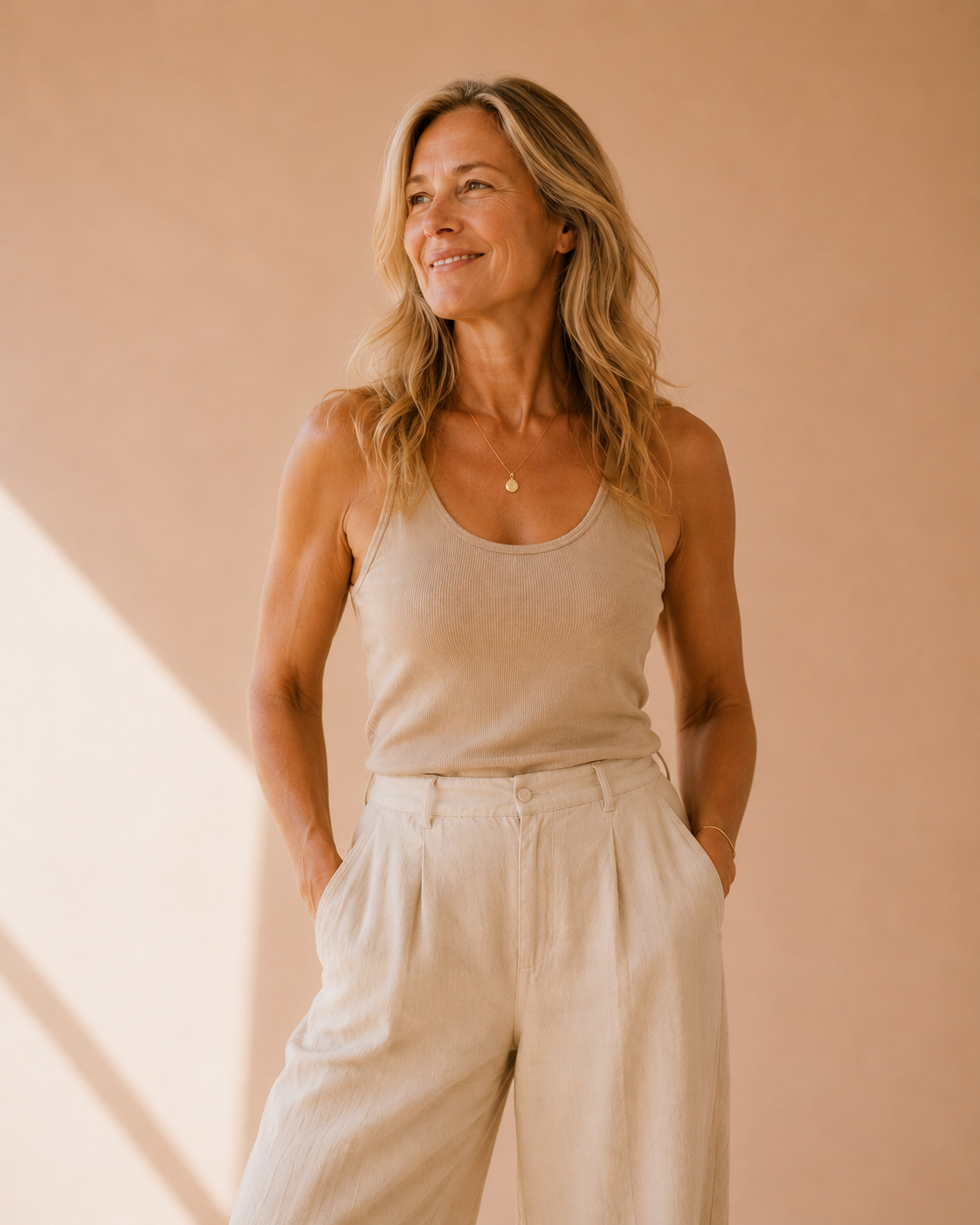 Woman in her 60's standing in a relaxed yet empowered stance
