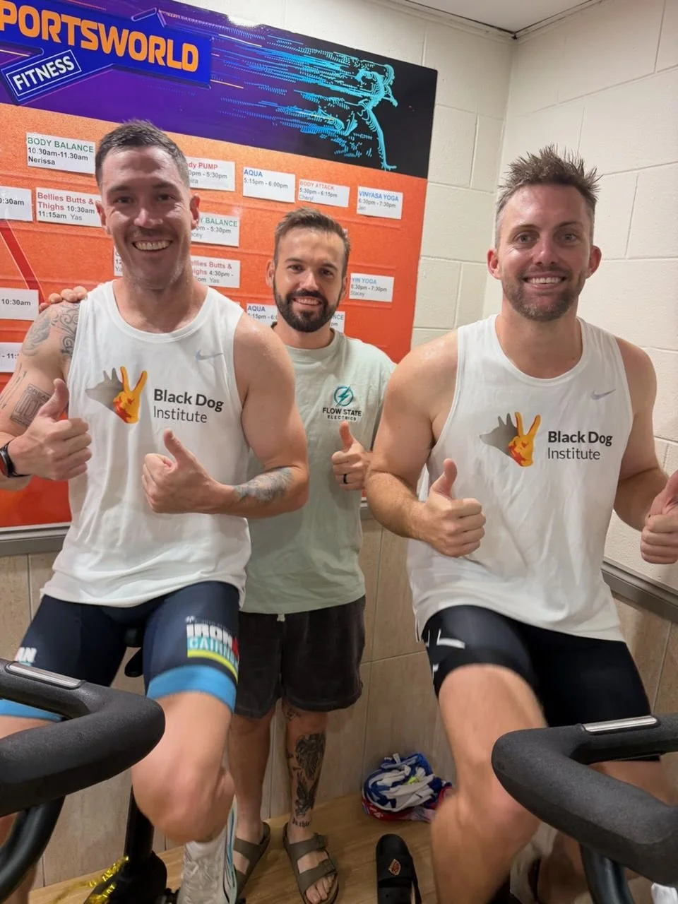 Lachlan from Flow State Electrics with Dion and Morgan on spin bikes, raising money for the Black Dog Institute