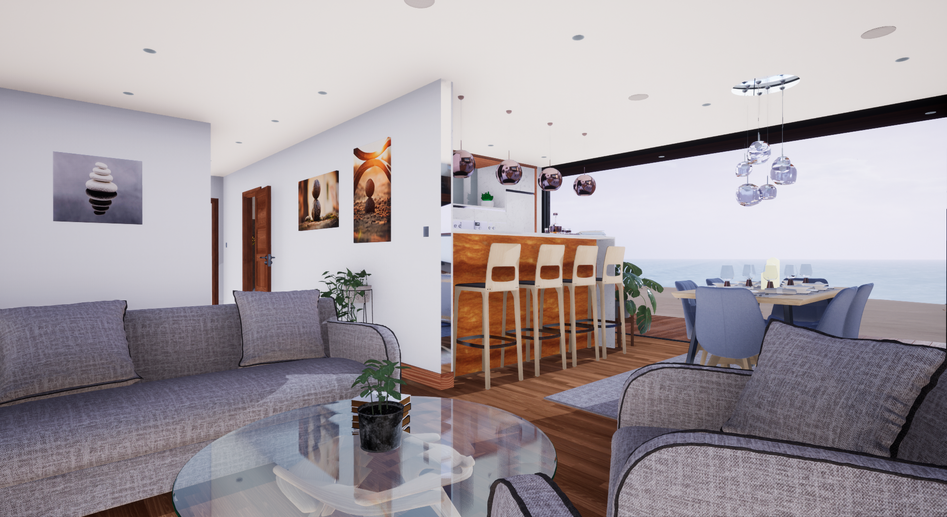 Living room and kitchen area with a view of the ocean, featuring gray sofas, wooden flooring, wall art, a dining table with chairs, a bar with barstools, and modern hanging pendant lights.