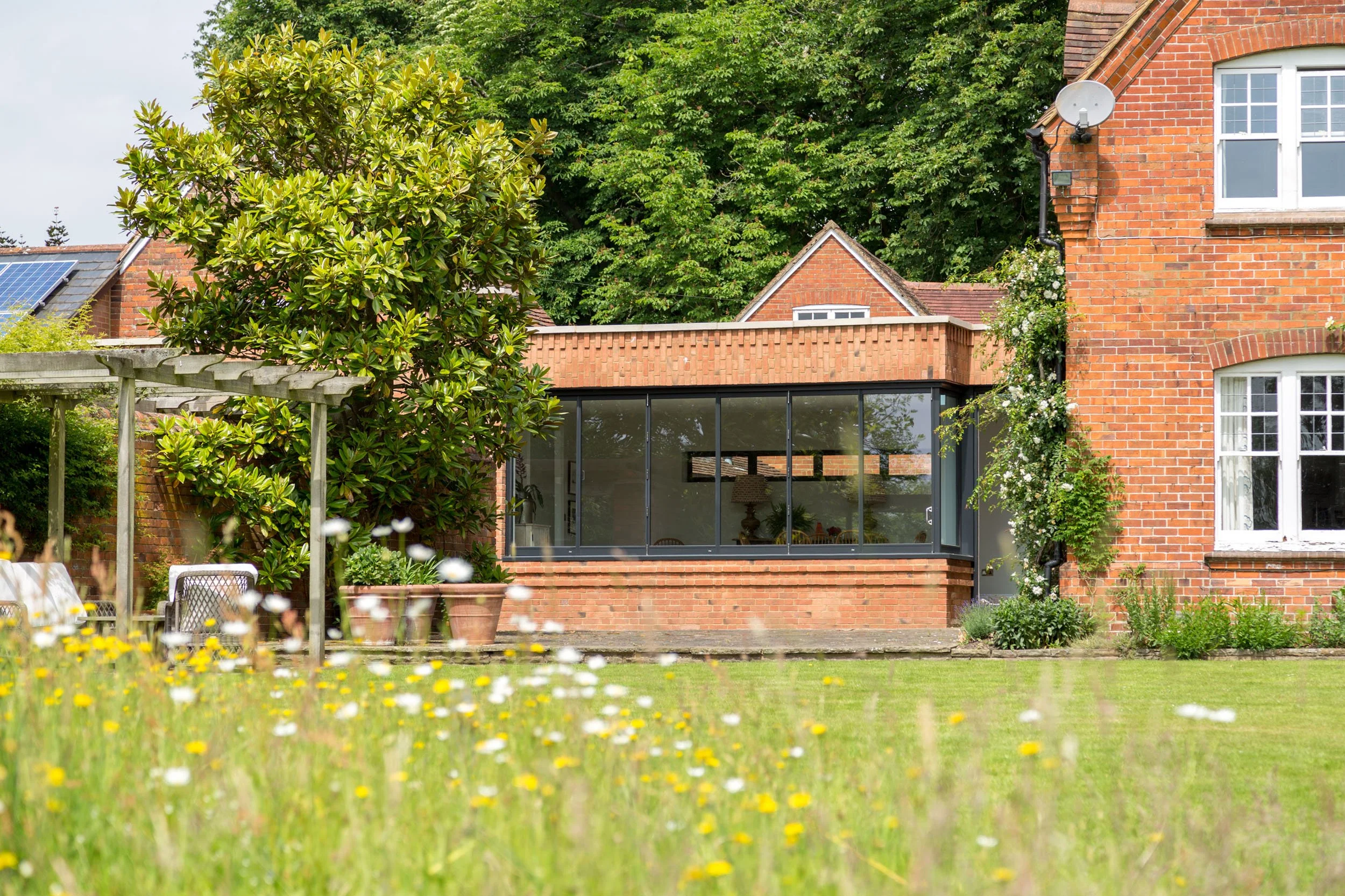 elizabeth-owens-architecture-oxfordshire-brick-extension-garden-wildflowers.jpg