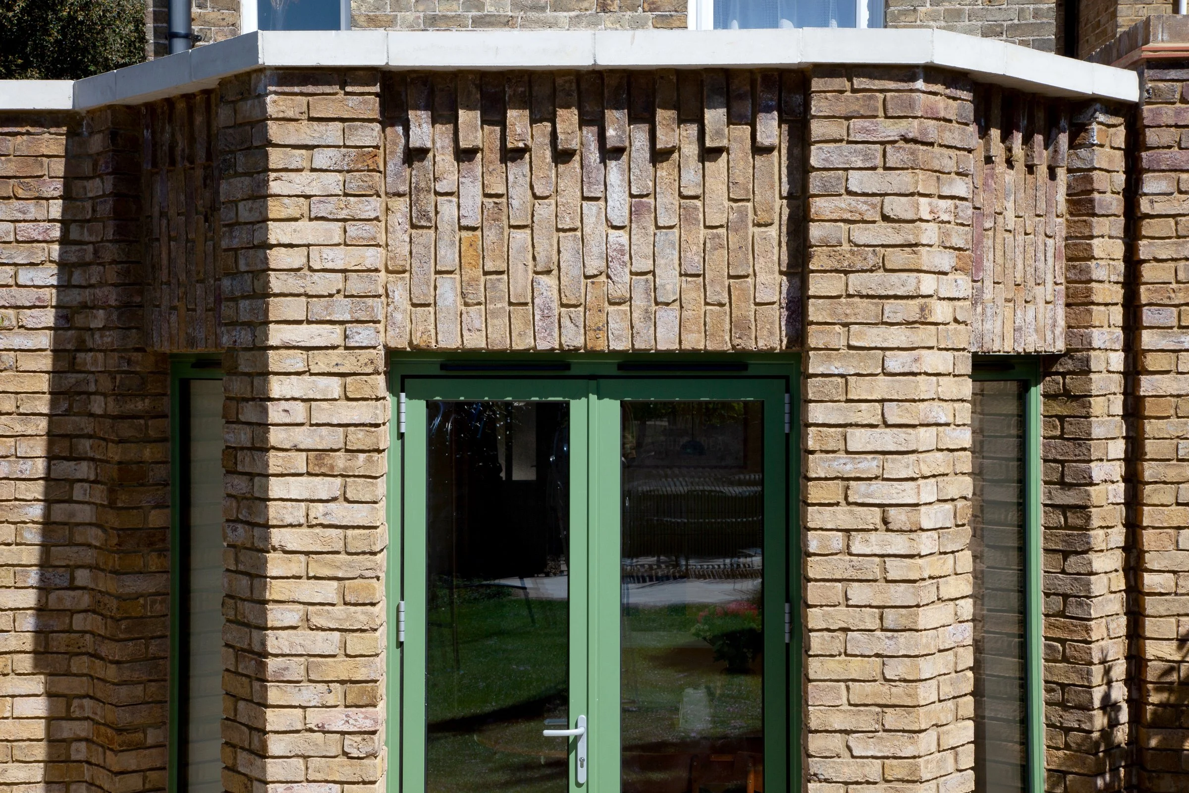 elizabeth-owens-architecture-broadstairs-kent-decorative-brickwork-green-doors-detail.jpg.jpg