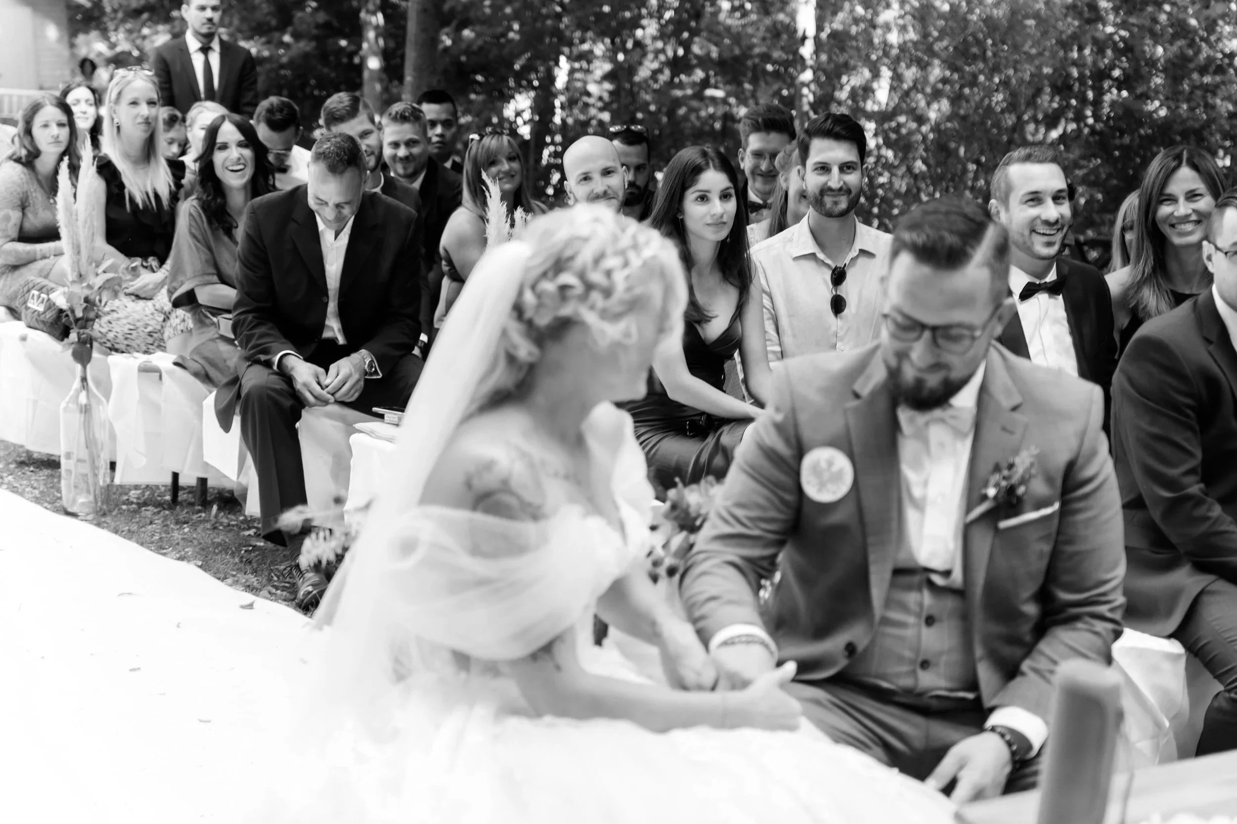 Emotional and funny moment during wedding ceremony, wedding guests laughing in the background. Captured in Bad Homburg by Jessica Di Salvo.