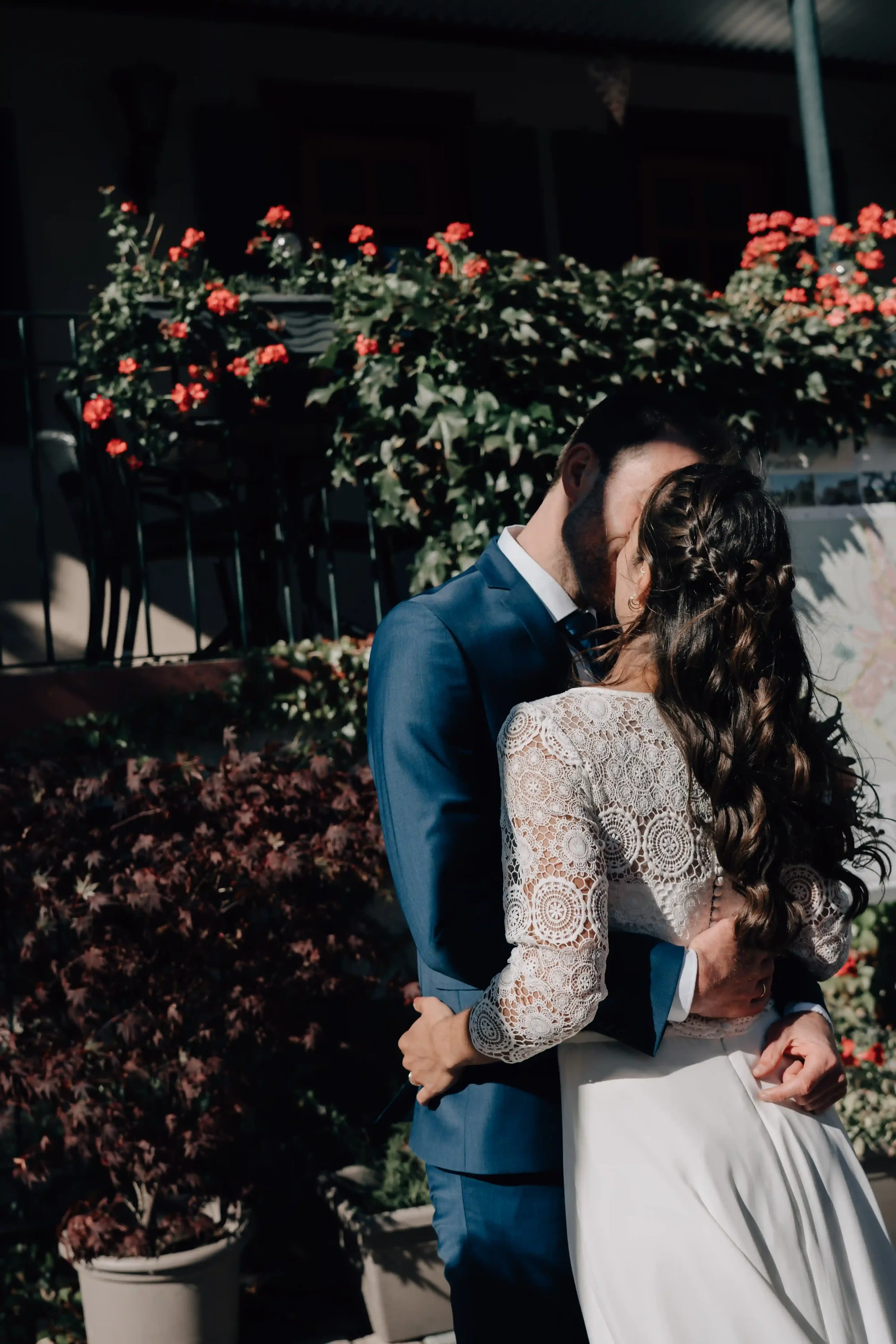 Intimate moment between bride and groom with golden light, Germany.