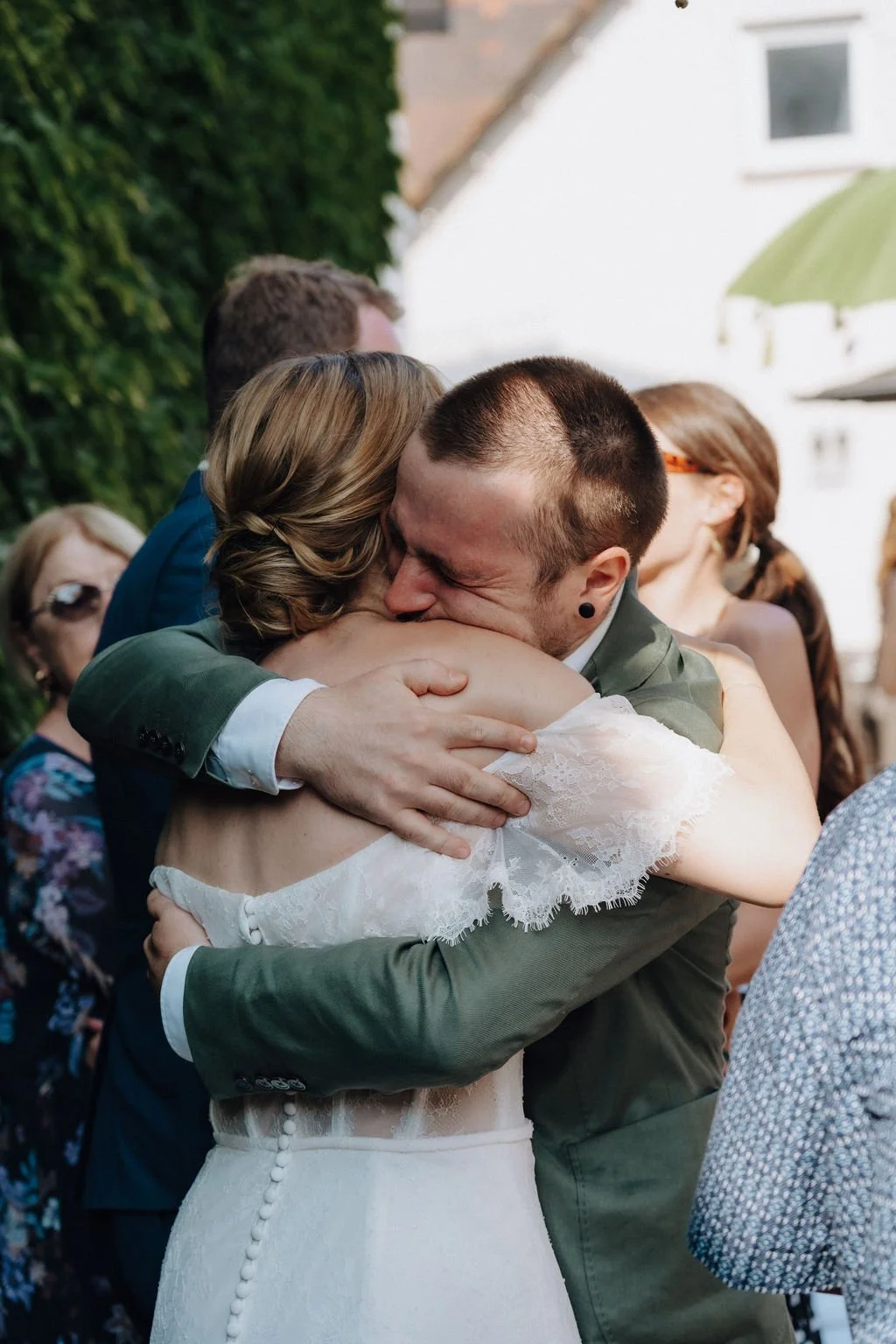 Emotional moment between wedding guest and bride by wedding photographer Jessica Di Salvo.