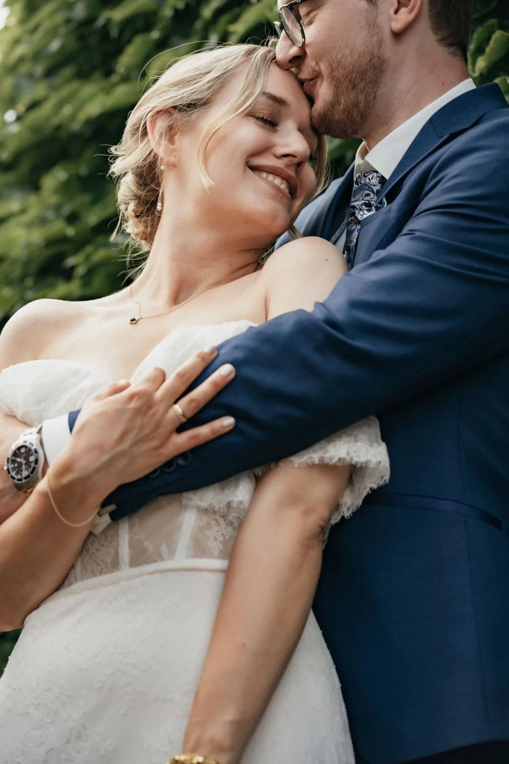 Groom kissing bride which is smiling captured by cinematic wedding photographer Jessica Di Salvo.