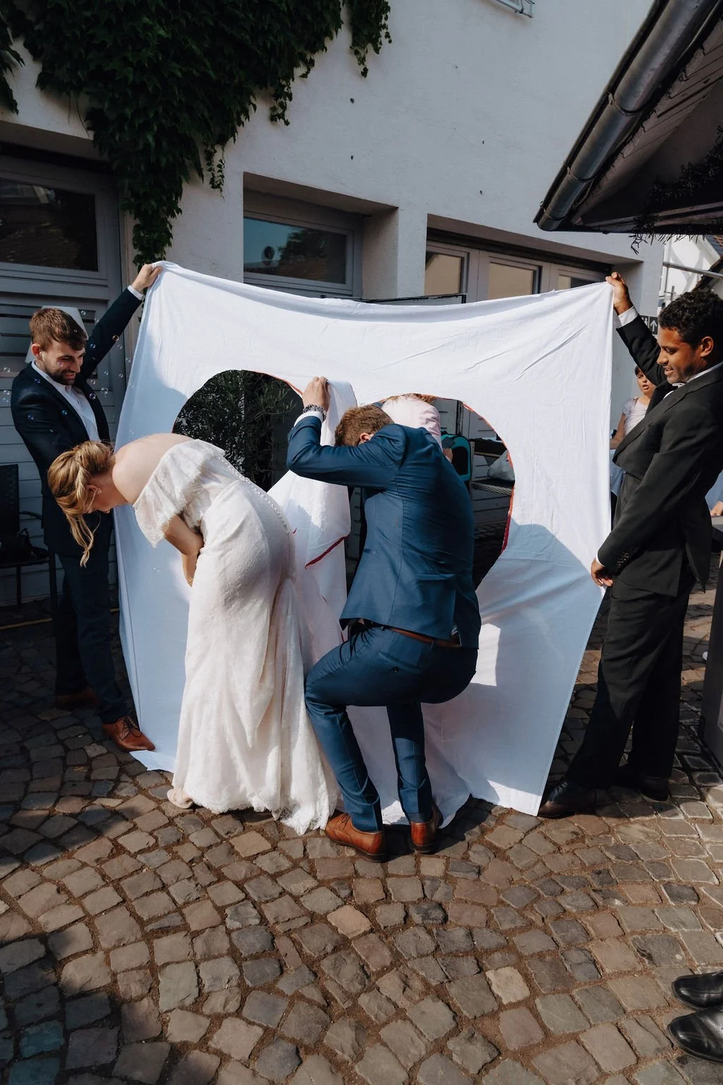 Married couple following german tradition and cutting a heart out together in Hochheim, Germany.