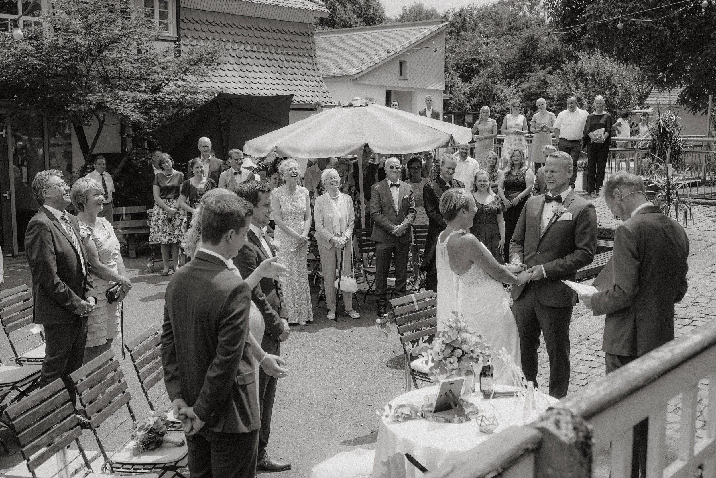 Small ceremony wedding moment, black and white, Germany.