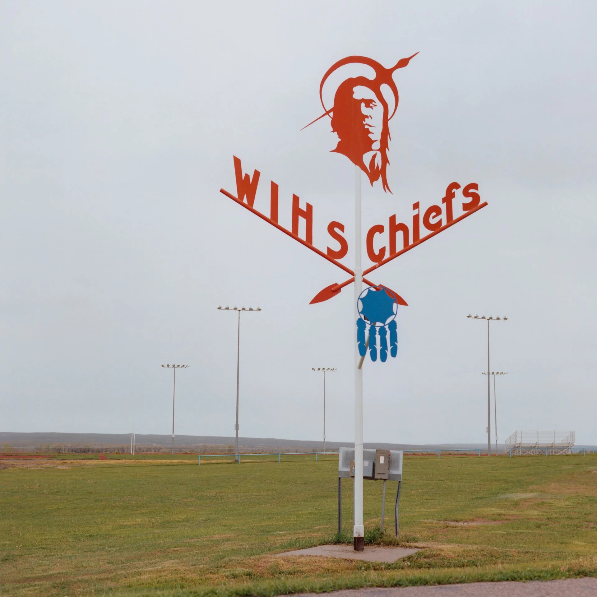 The high school sign of the football field on the Wind River Indian Reservation in Wyoming. Native American terms and iconography are often controversially used outside Native communities as sports team mascots with the most notorious example being t