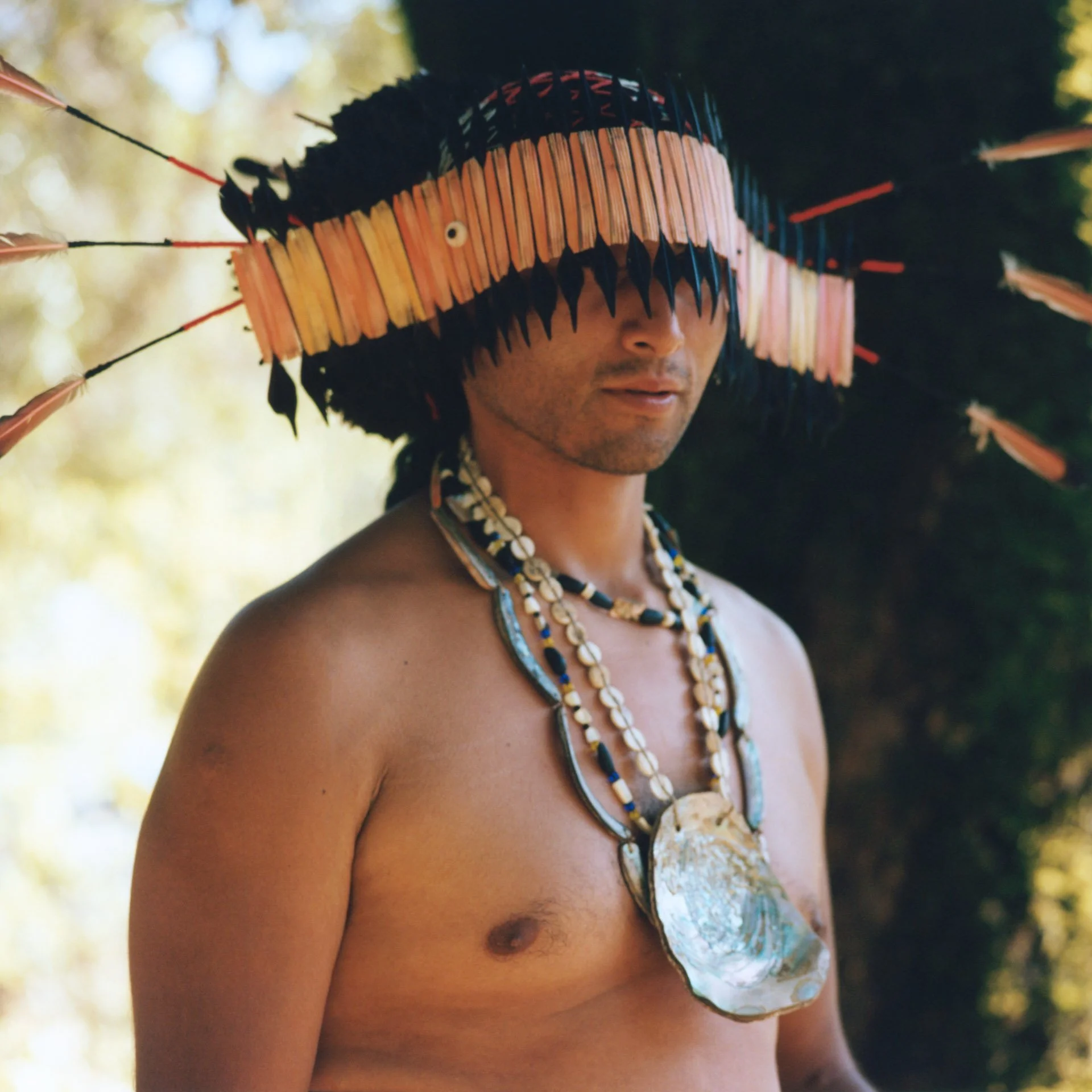 Pom, son of Chief Caleen Sisk, prepares for a ceremonial dance